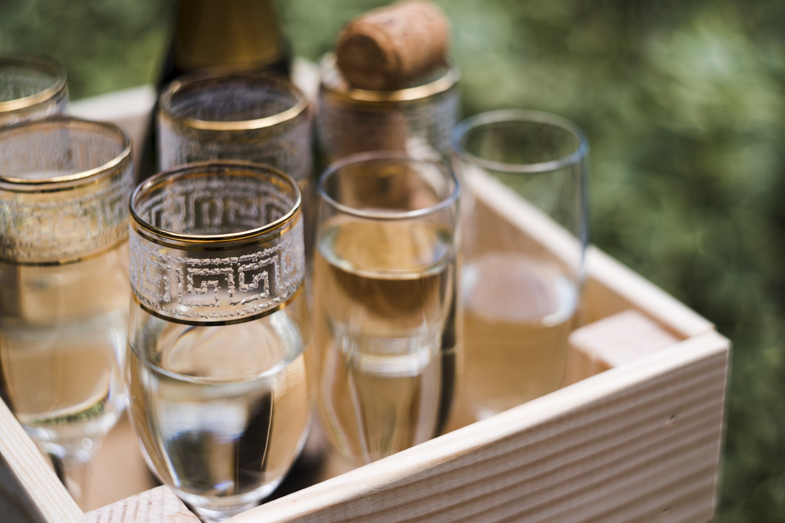 champagne-glasses-wooden-crate-outdoors.jpg