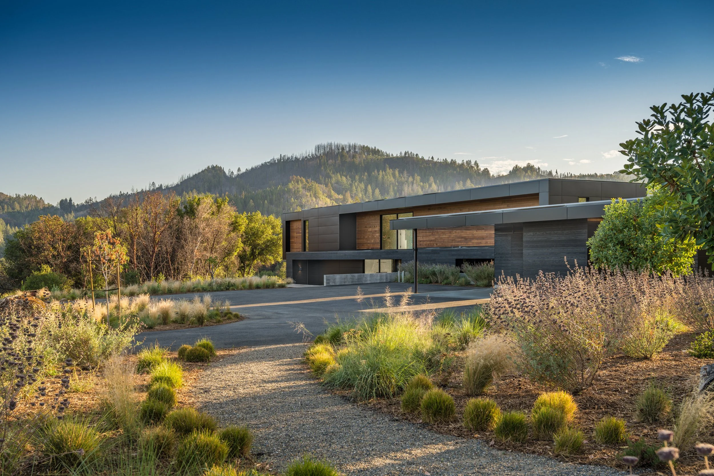 Modern desert residence with flat roof and large windows, representing luxury property furnishing and owner-side project support.