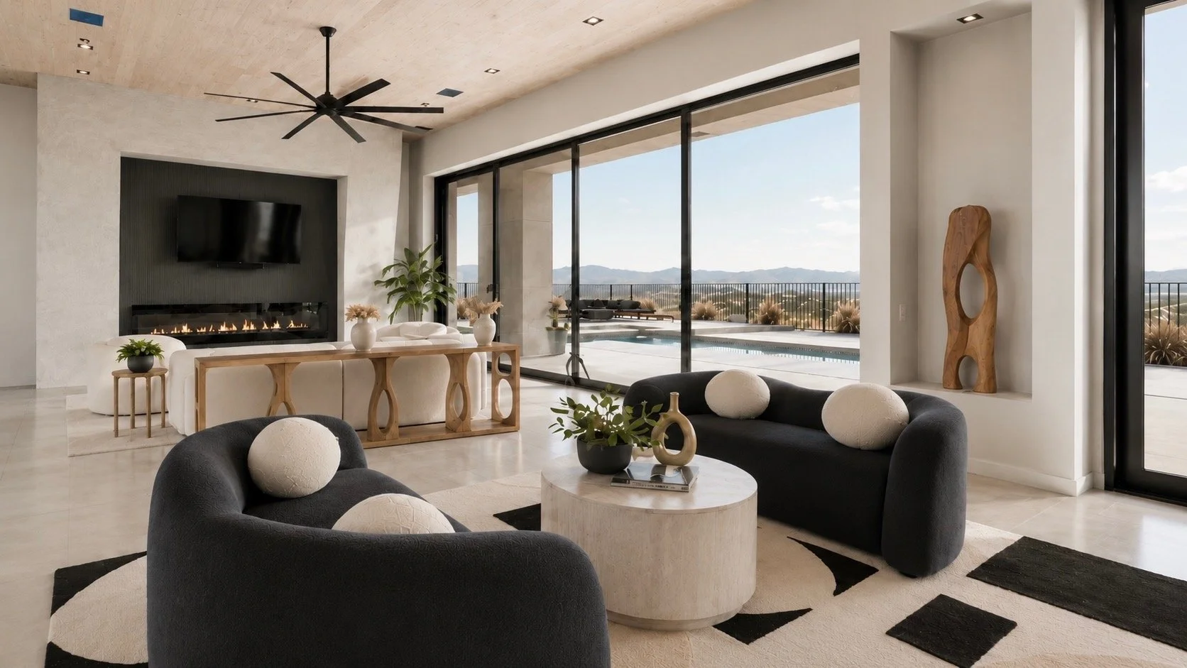 Modern living room with curved sofas, fireplace, pool access, and luxury furnishing selection for a refined residential or hospitality property.