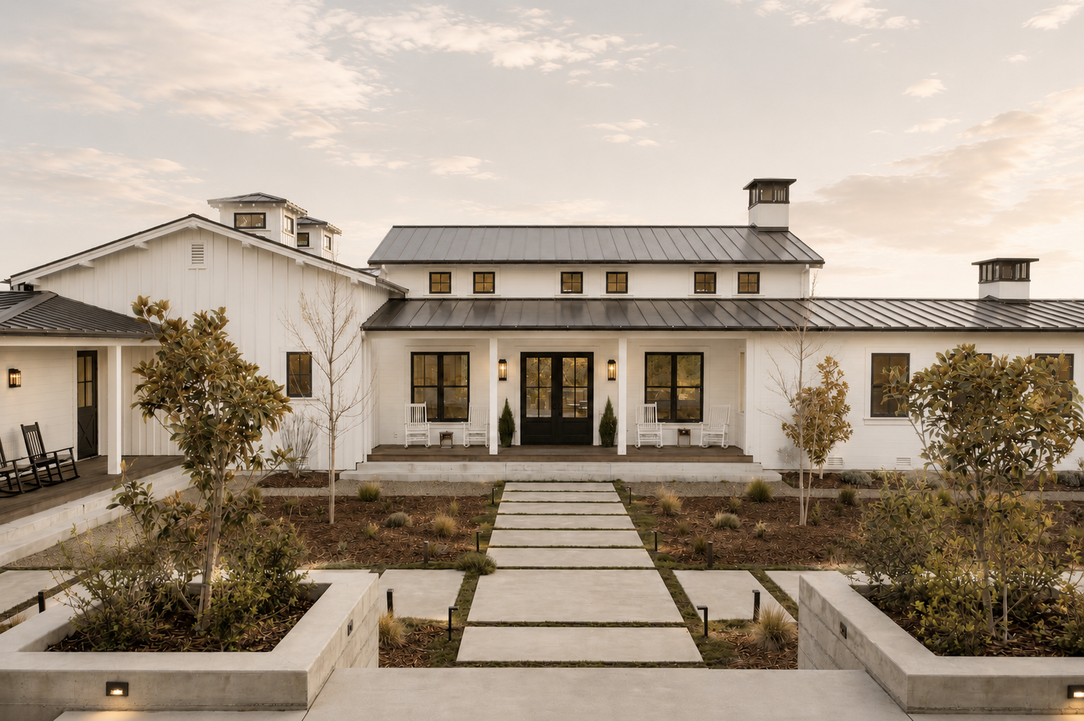Modern farmhouse residence with front porch and landscaped exterior, supported through furnishing selection, FF&E, and procurement planning.