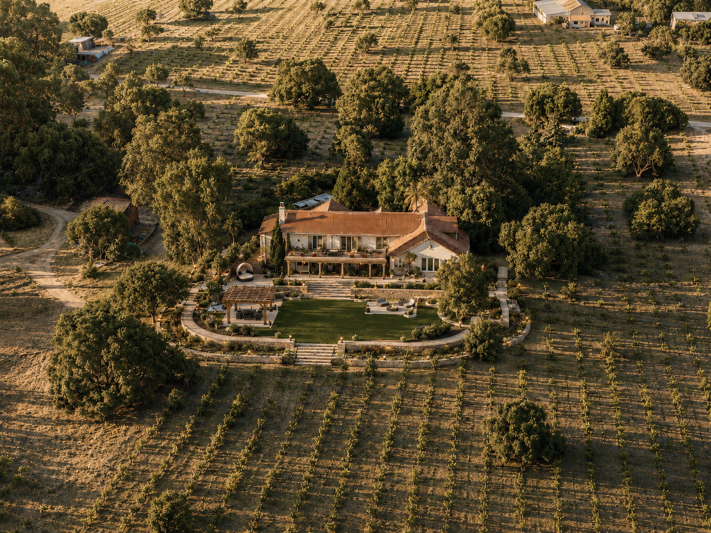 A large house with a red-tiled roof and a big backyard, surrounded by numerous trees, in a rural area with fields and other houses in the background.