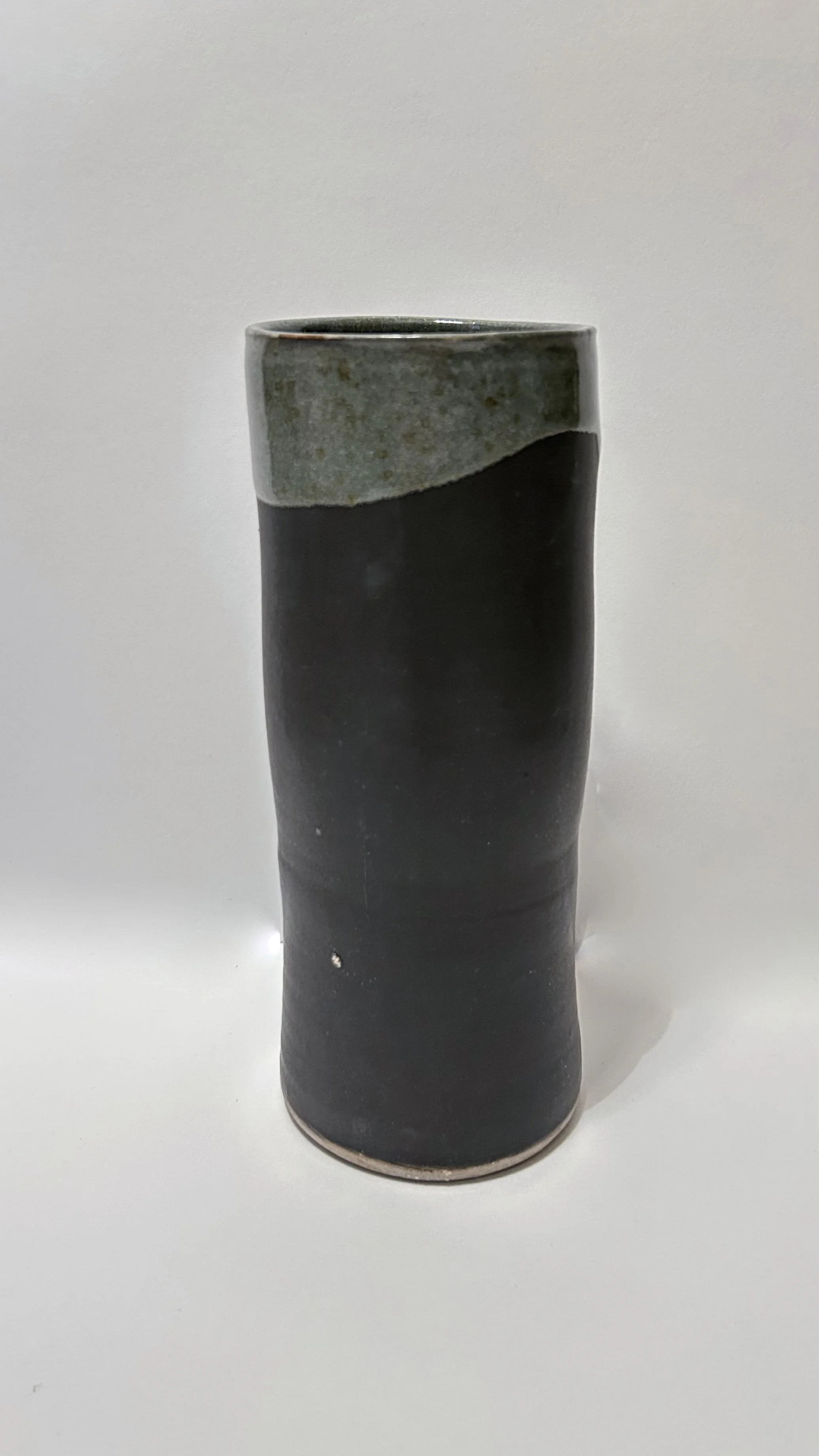 black matte layered with unstable copper glazes ^10