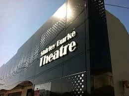 Exterior of the Shirley Burke Theatre building with its name displayed on the facade, where the AABC Competition is held