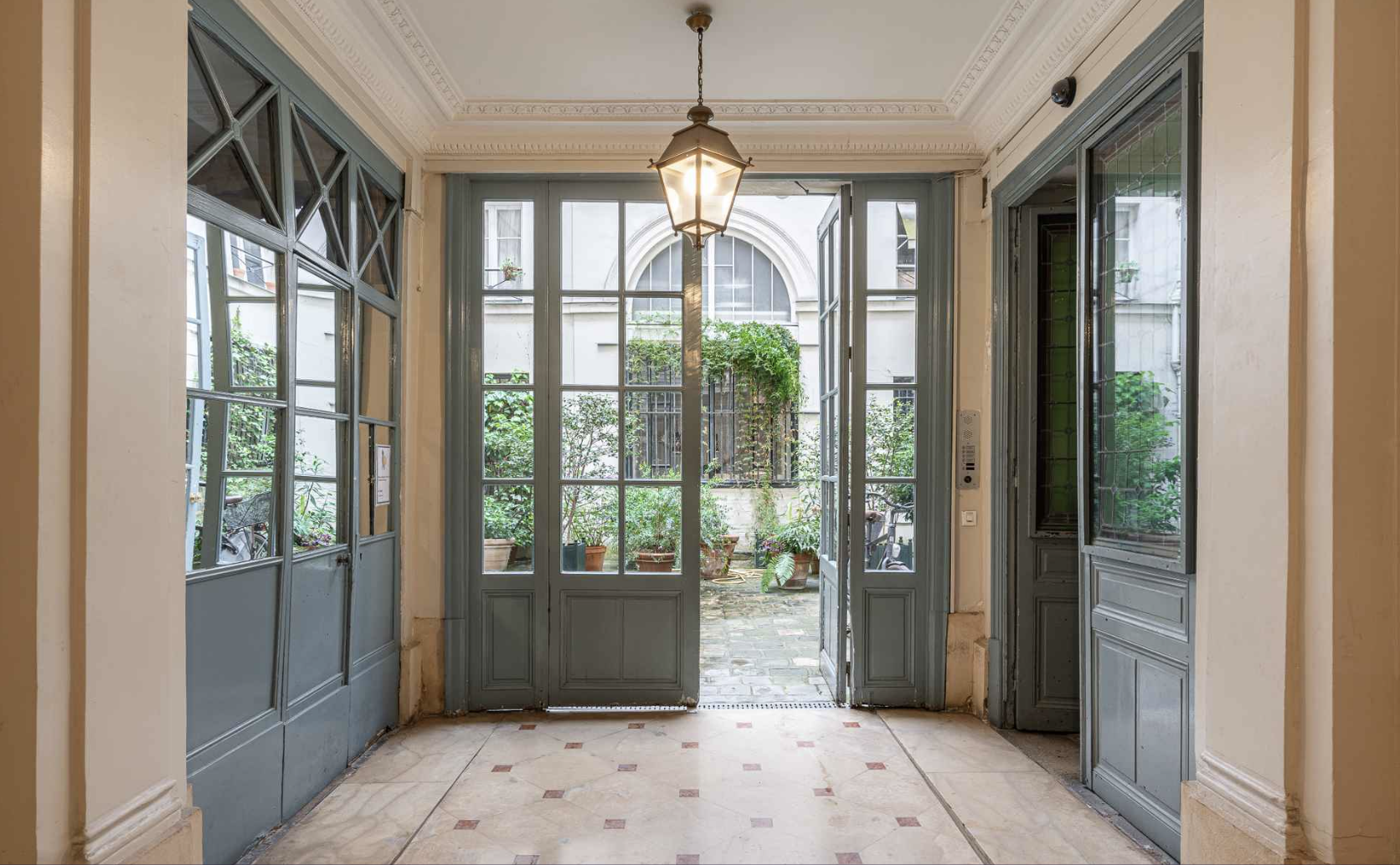 elegant foyer in paris with chandelier