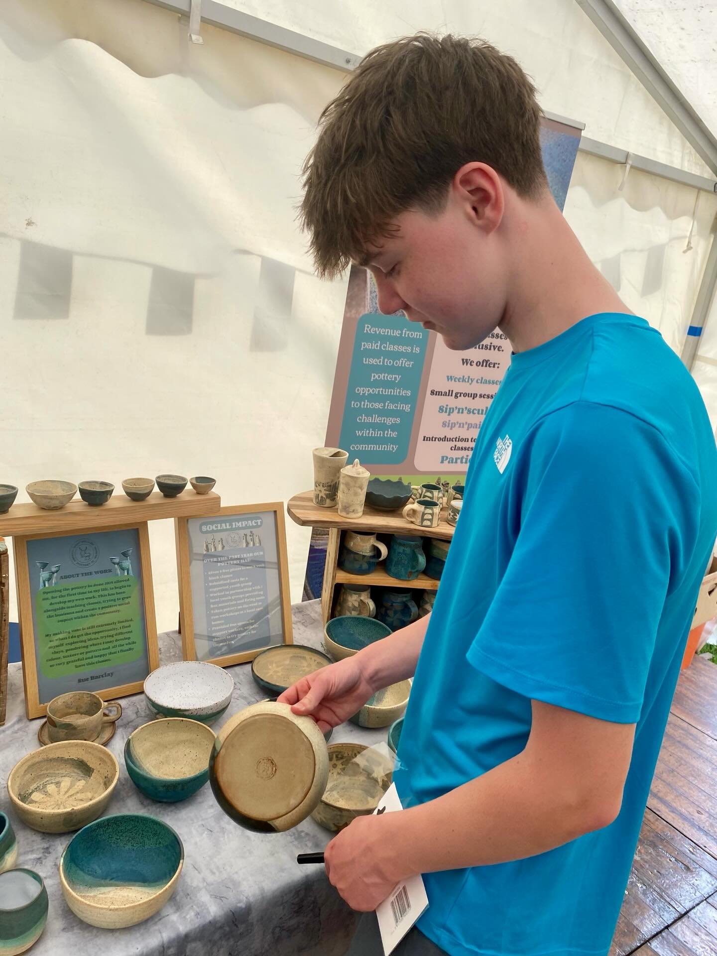 Replacing lost price stickers and helping with set up. Thanks to the work experience boy, he&rsquo;s been great and would have him back anytime! #artatancrum#socialenterprise#potteryclasses#scottishborderspottery#artfair