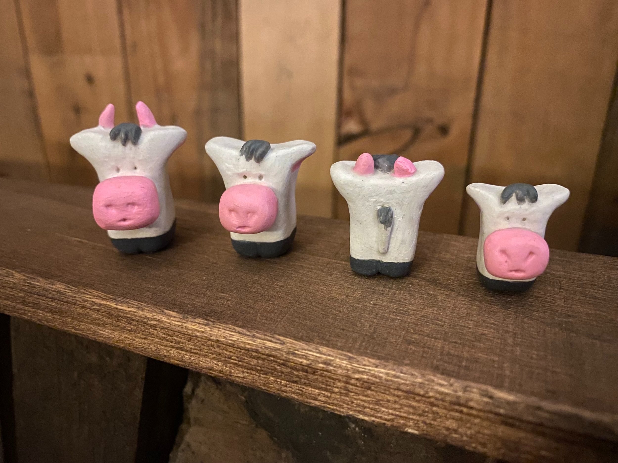Handmade cute family of pottery cows horns