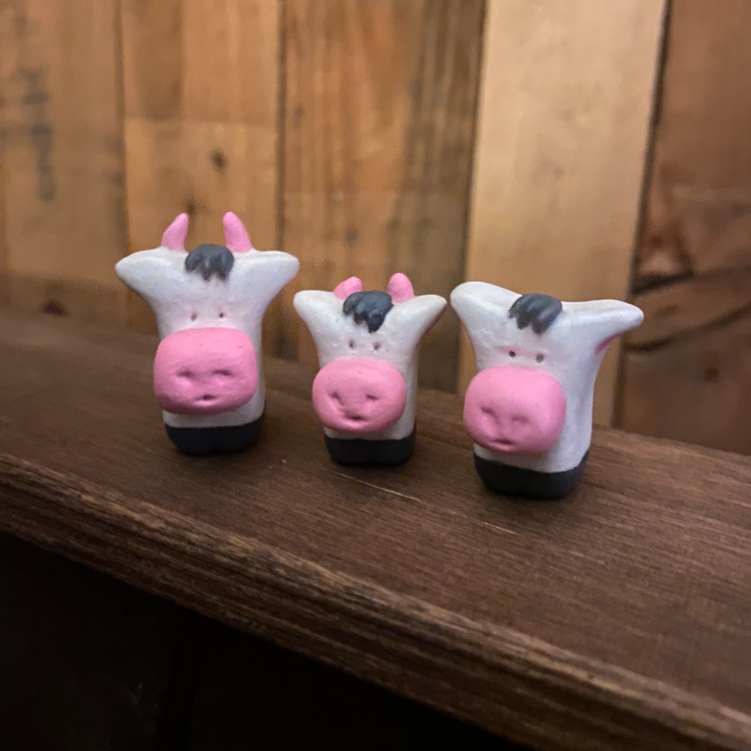 Handmade cute family of pottery cows horns black and white