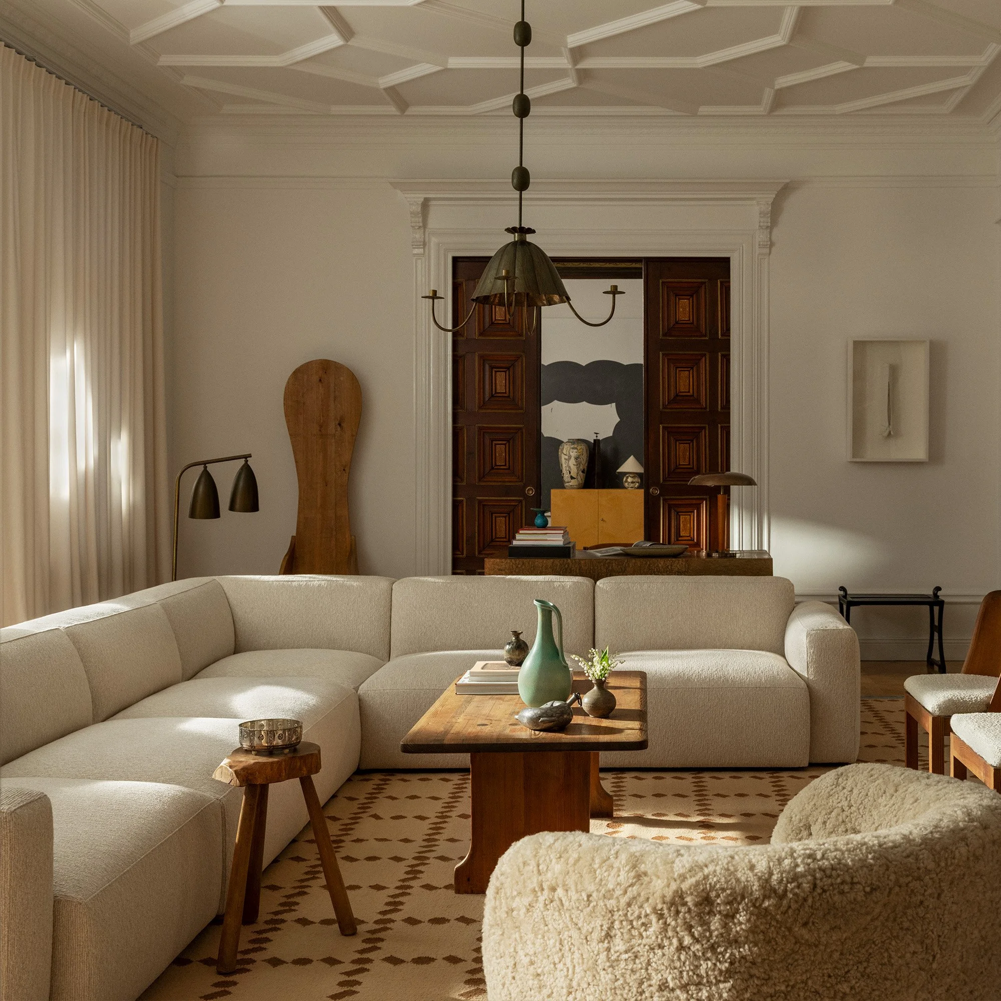 Residential living room designed by Max Wolstencroft with custom furnishings, textured fabrics and modern European styling.