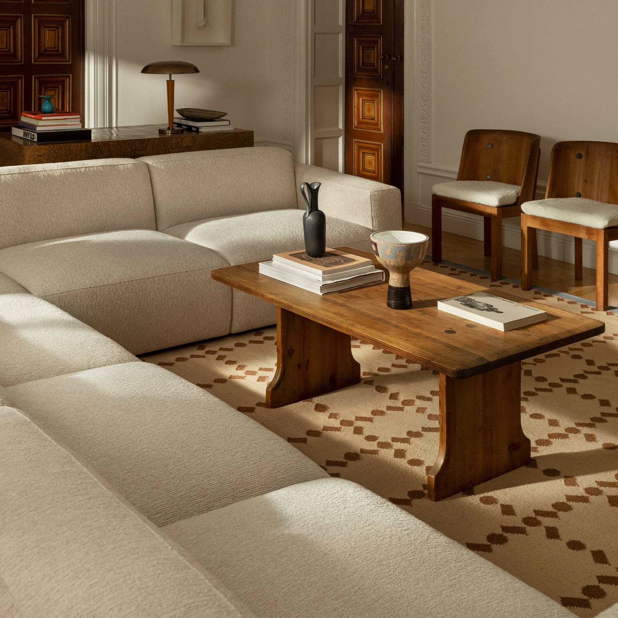 Residential living room designed by Max Wolstencroft with custom furnishings, textured fabrics and modern European styling.