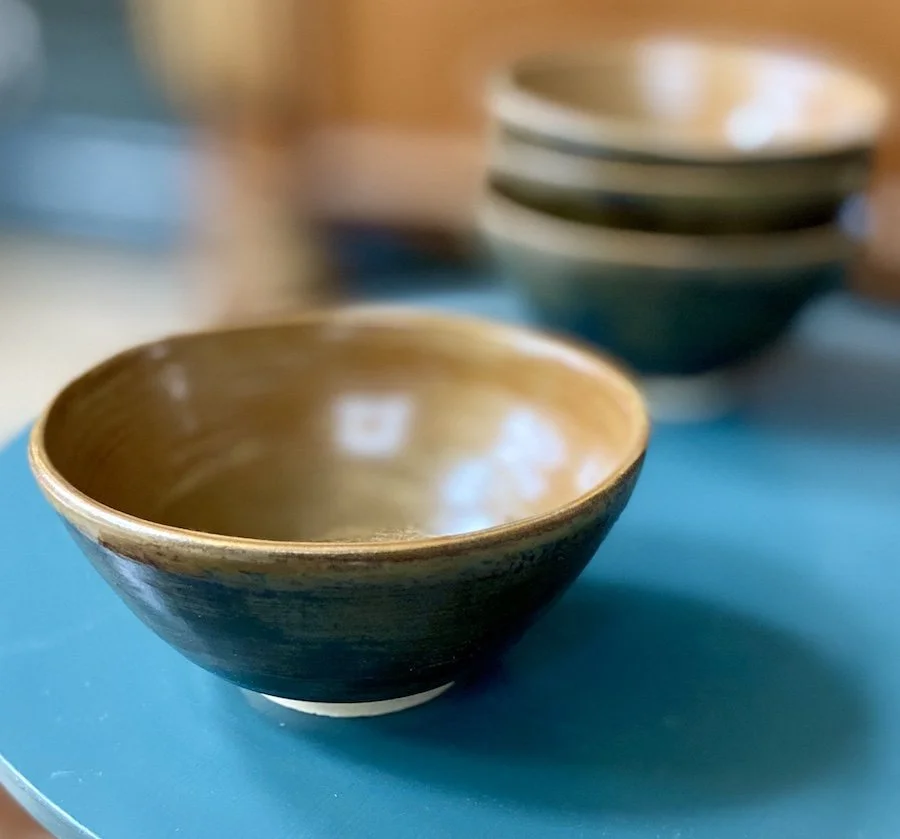 unique hand built small medium bowl. Satin toffee glaze inside with a glossy dark olive effect outside. White stoneware, unique