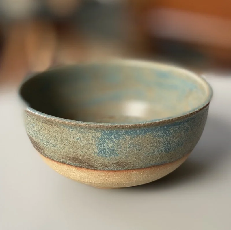 unique hand built small medium bowl. Subtle blue glaze inside half outside toasted buff stoneware, one-off