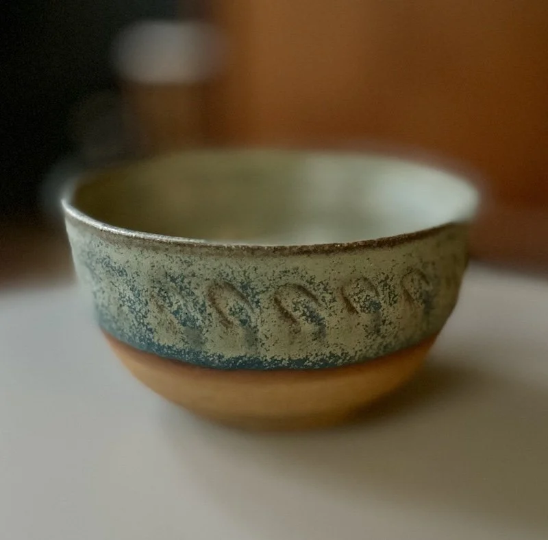 unique hand built medium sized bowl. Subtle blue glaze inside half outside toasted buff stoneware, one-off, hand carved