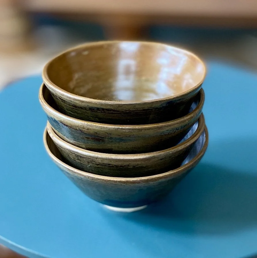 unique hand built small medium bowl. Satin toffee glaze inside with a glossy dark olive effect outside. White stoneware, unique