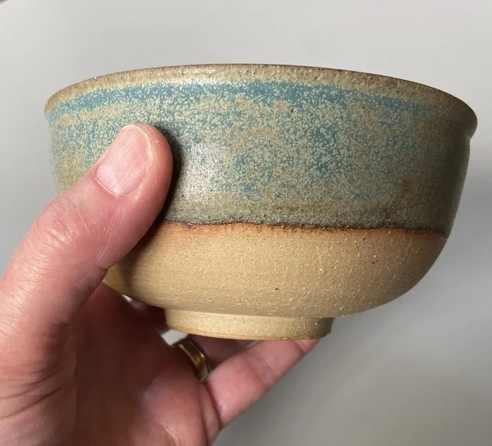 unique hand built small medium bowl. Subtle blue glaze inside half outside toasted buff stoneware, one-off