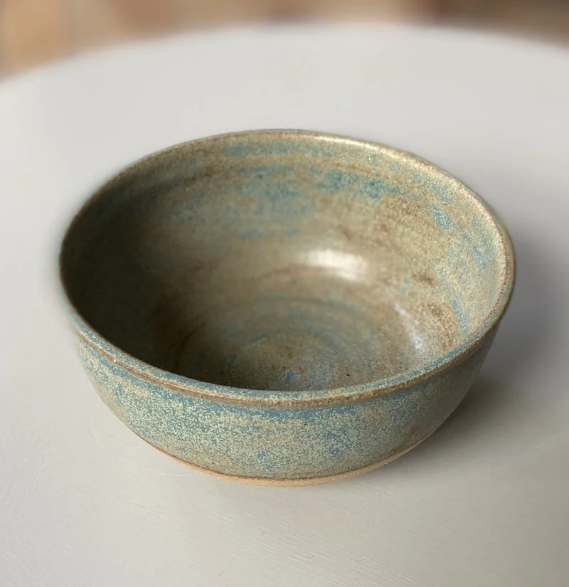 unique hand built small medium bowl. Subtle blue glaze inside half outside toasted buff stoneware, one-off