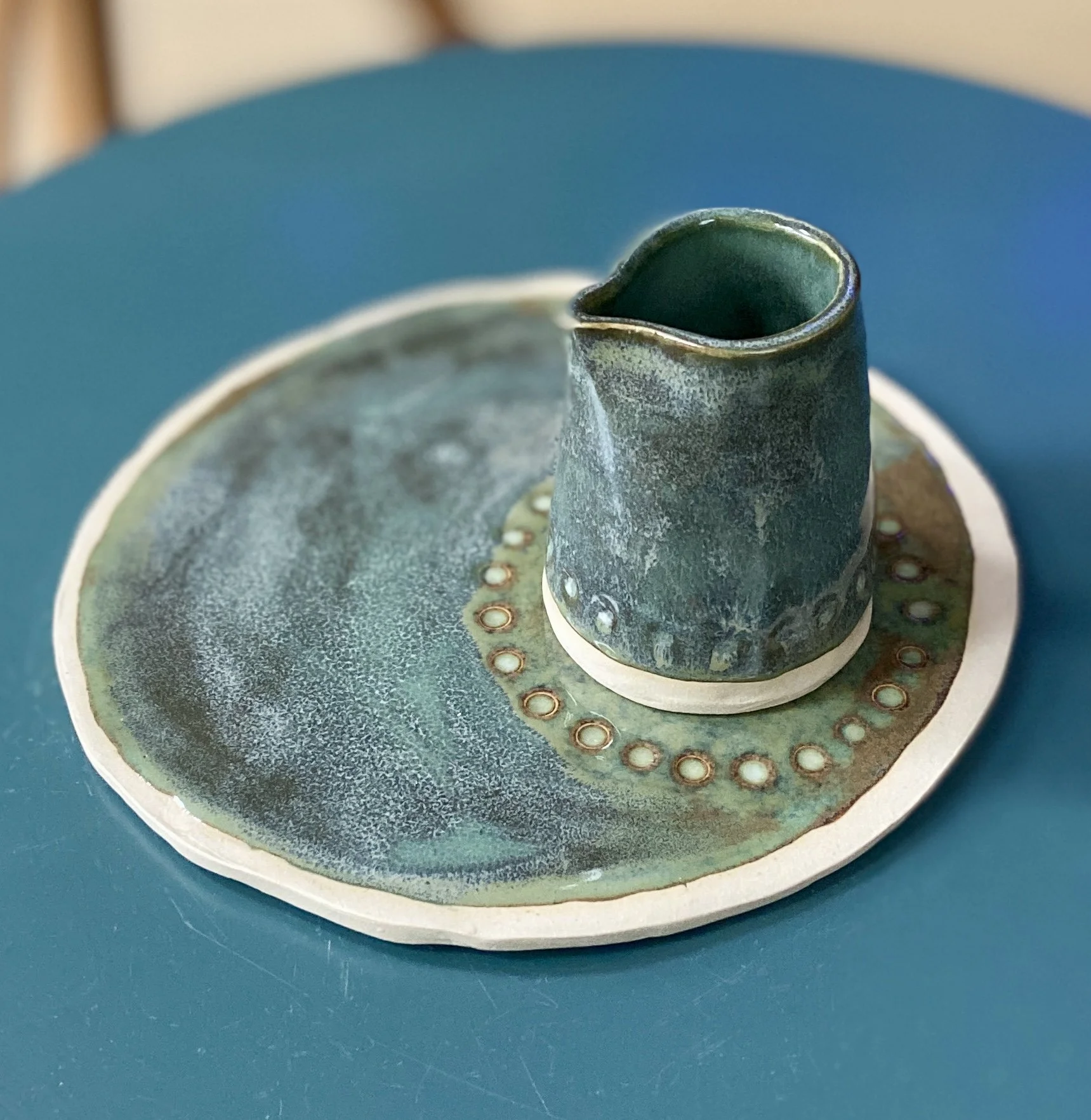 Glossy flat side plates in an unusual glaze multi tones of blue and bronze. textures flow beautifully over carved details. Hand made slabbed, cut by hand for a unique shape. (Copy)