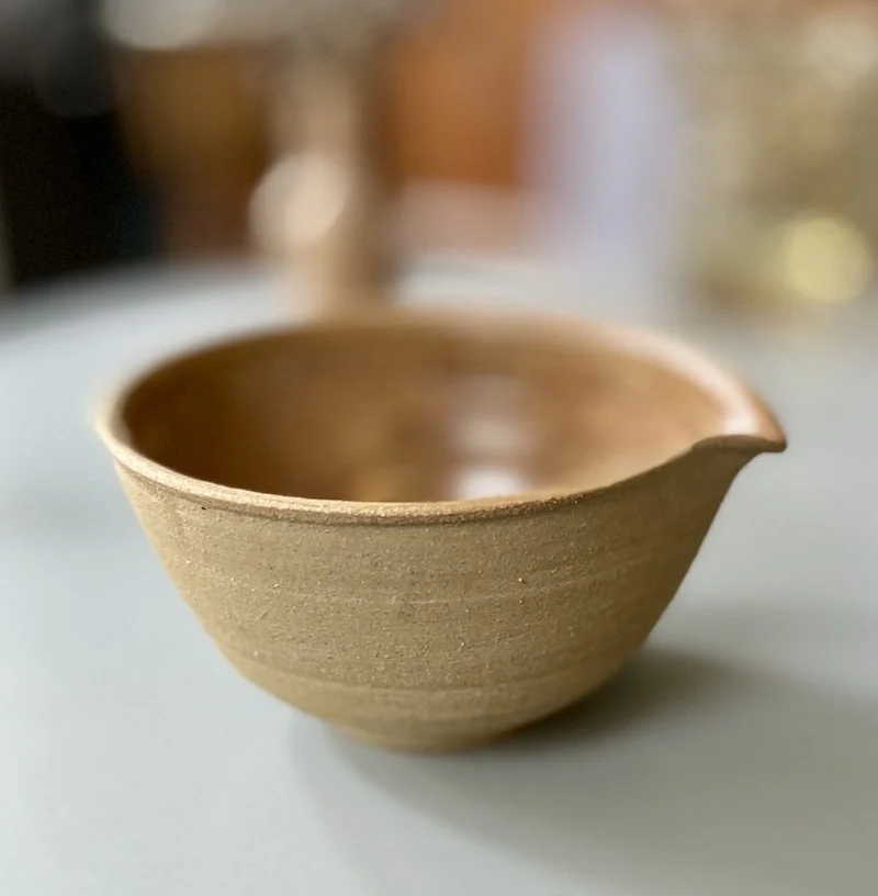 unique, one-off little mixing bowl glossy toffee glaze Natural rough stoneware outside. For salad dressings from kitchen to tableware