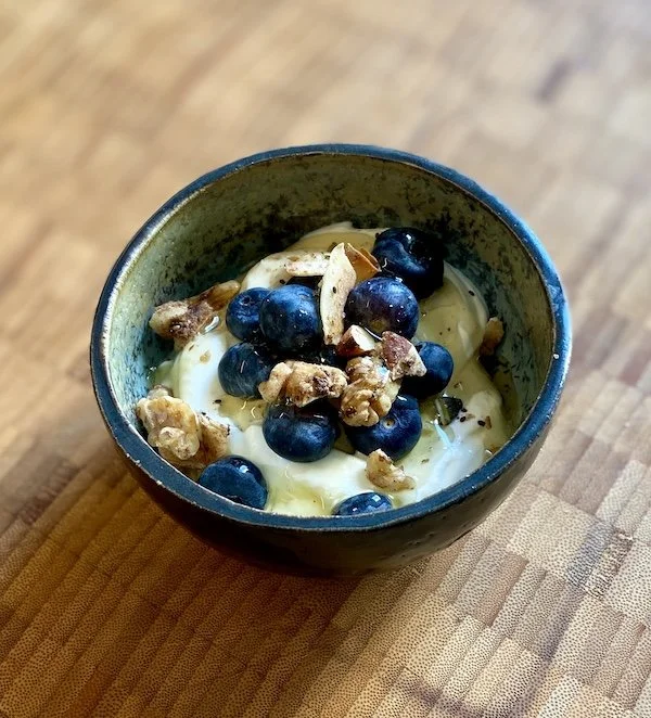 unique, one-off piece, small bowl for serving snacks, dips and olives. Glossy black glaze outside contrasts with natural bare stoneware with a beautiful turquoise, green and crystallised inside.