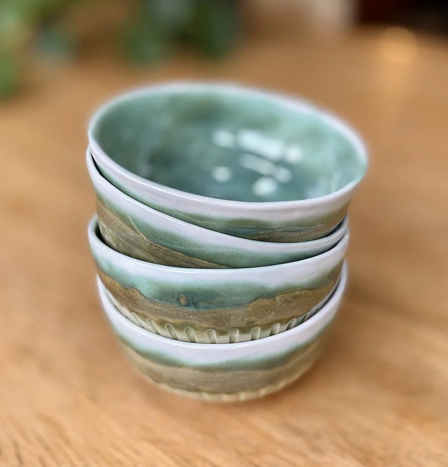unique hand built medium bowl. Glossy teal green and white glaze with carved detail. White stoneware, unique