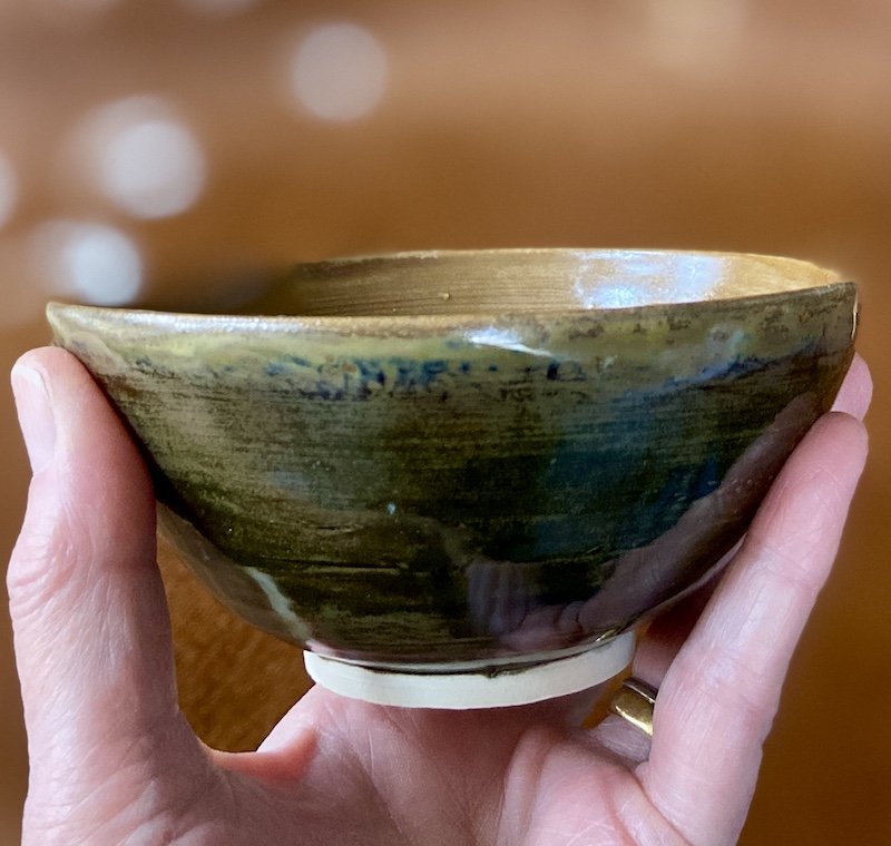 unique hand built small medium bowl. Satin toffee glaze inside with a glossy dark olive effect outside. White stoneware, unique