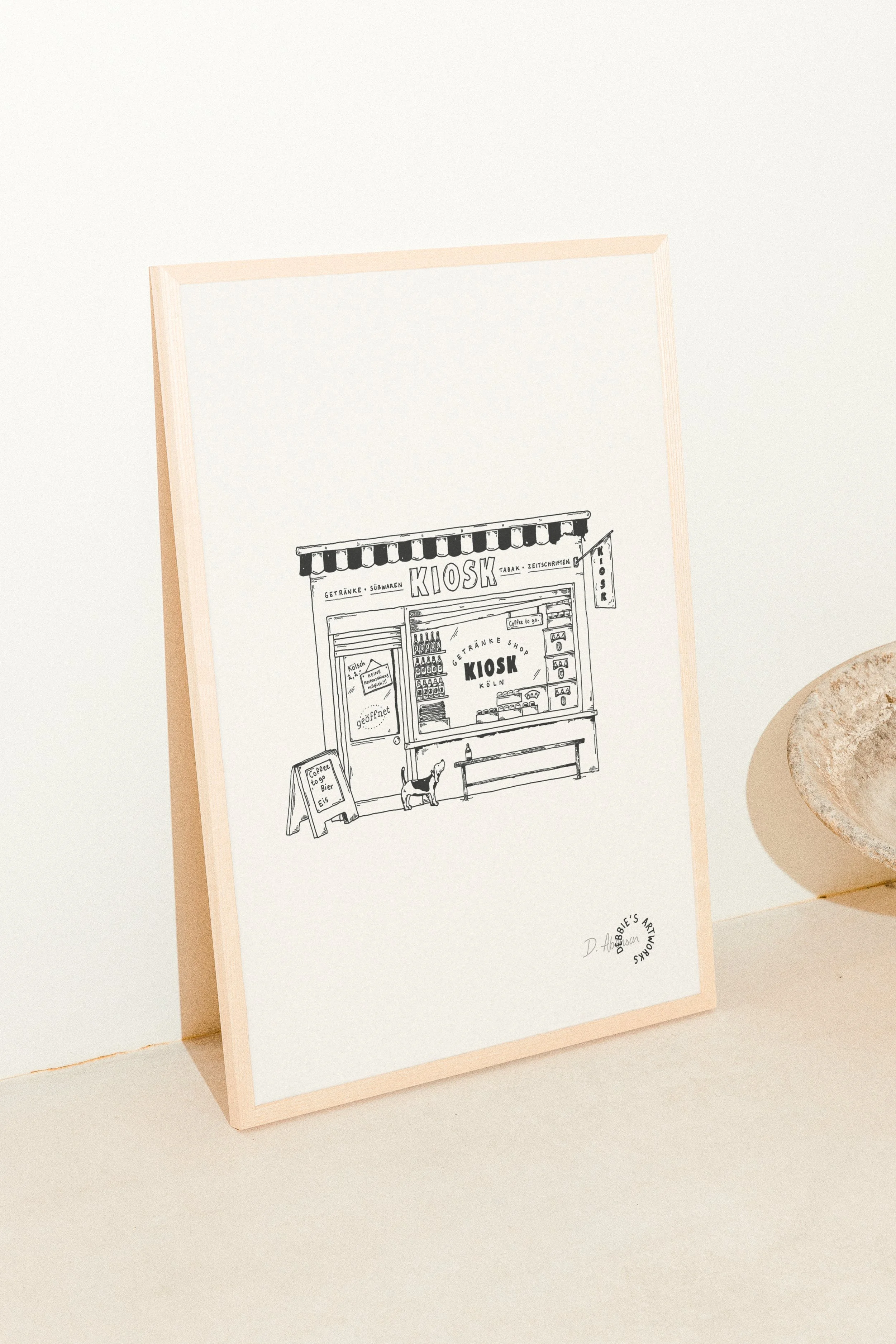 At the kiosk_Mockup Print_2 copie.jpg