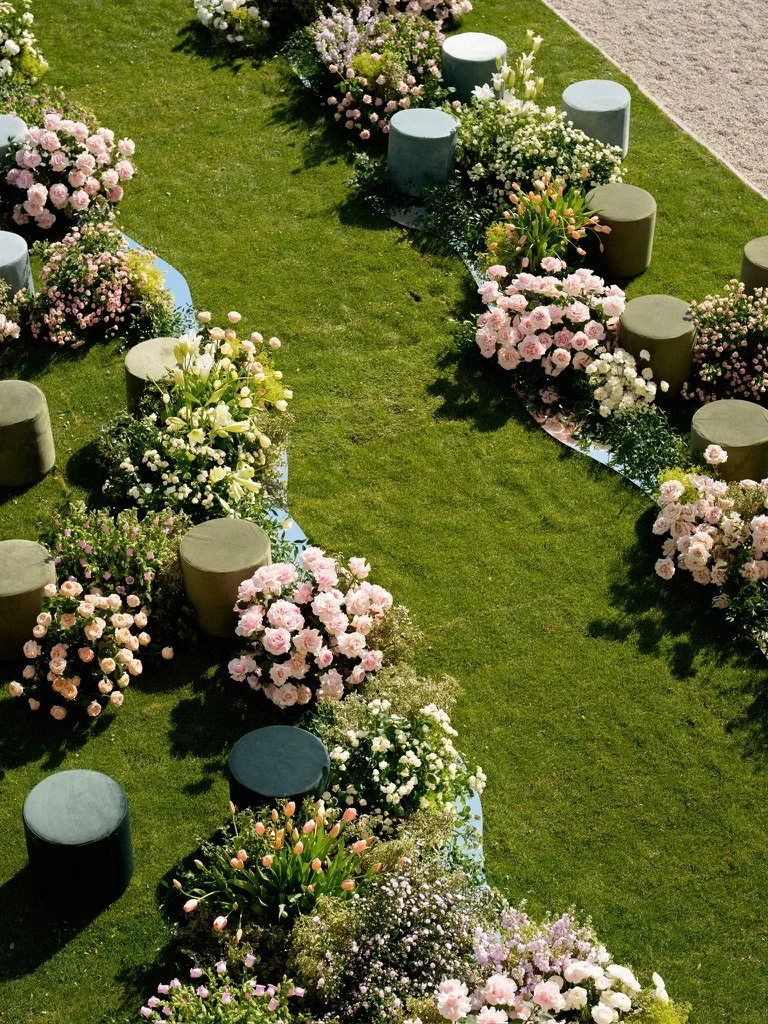 Mirrored streams winding between flower beds and velvet poufs on the lawn