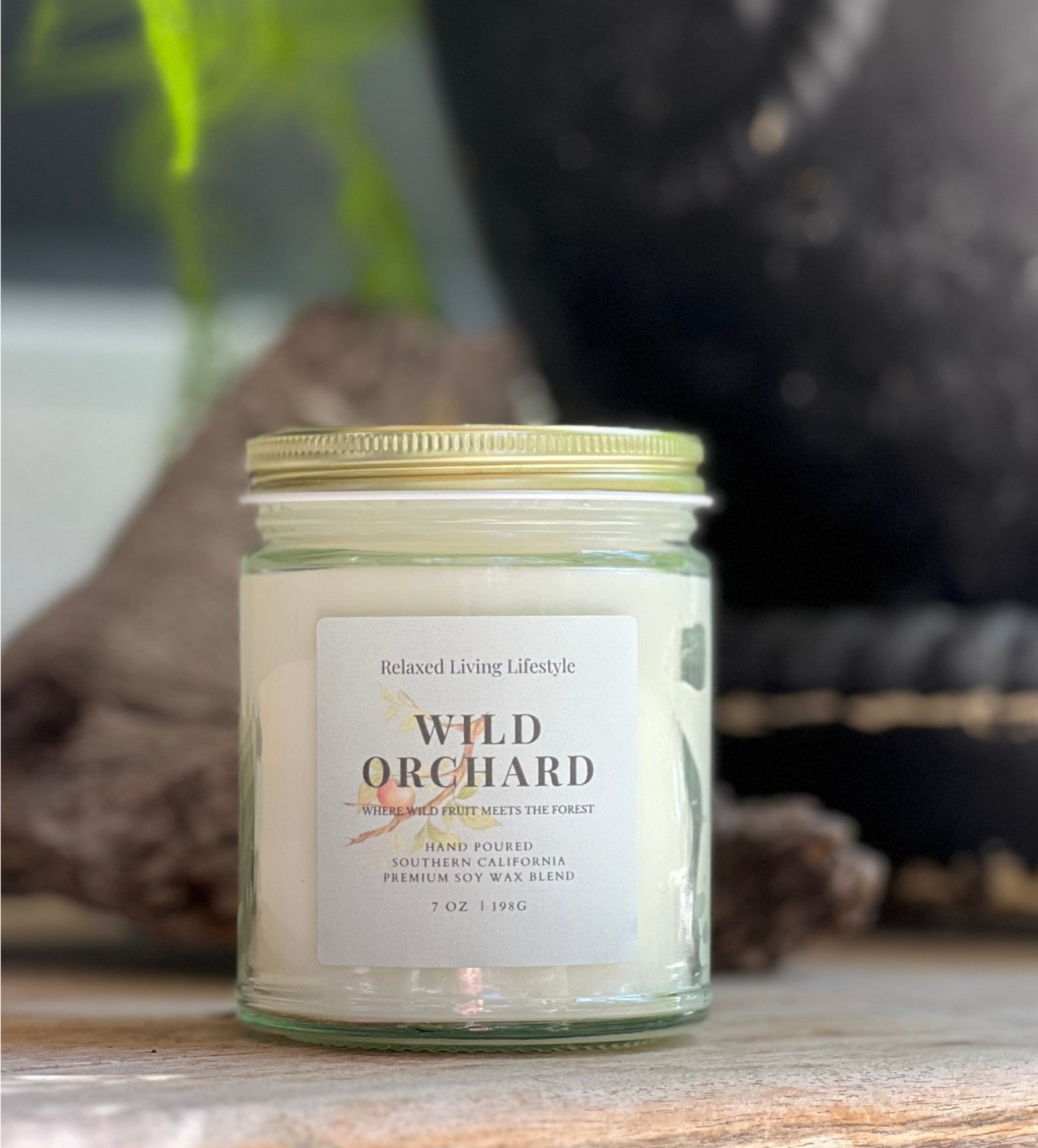 7oz hand-poured Wild Orchard soy candle in glass jar with soft cedar and fruit-inspired scent