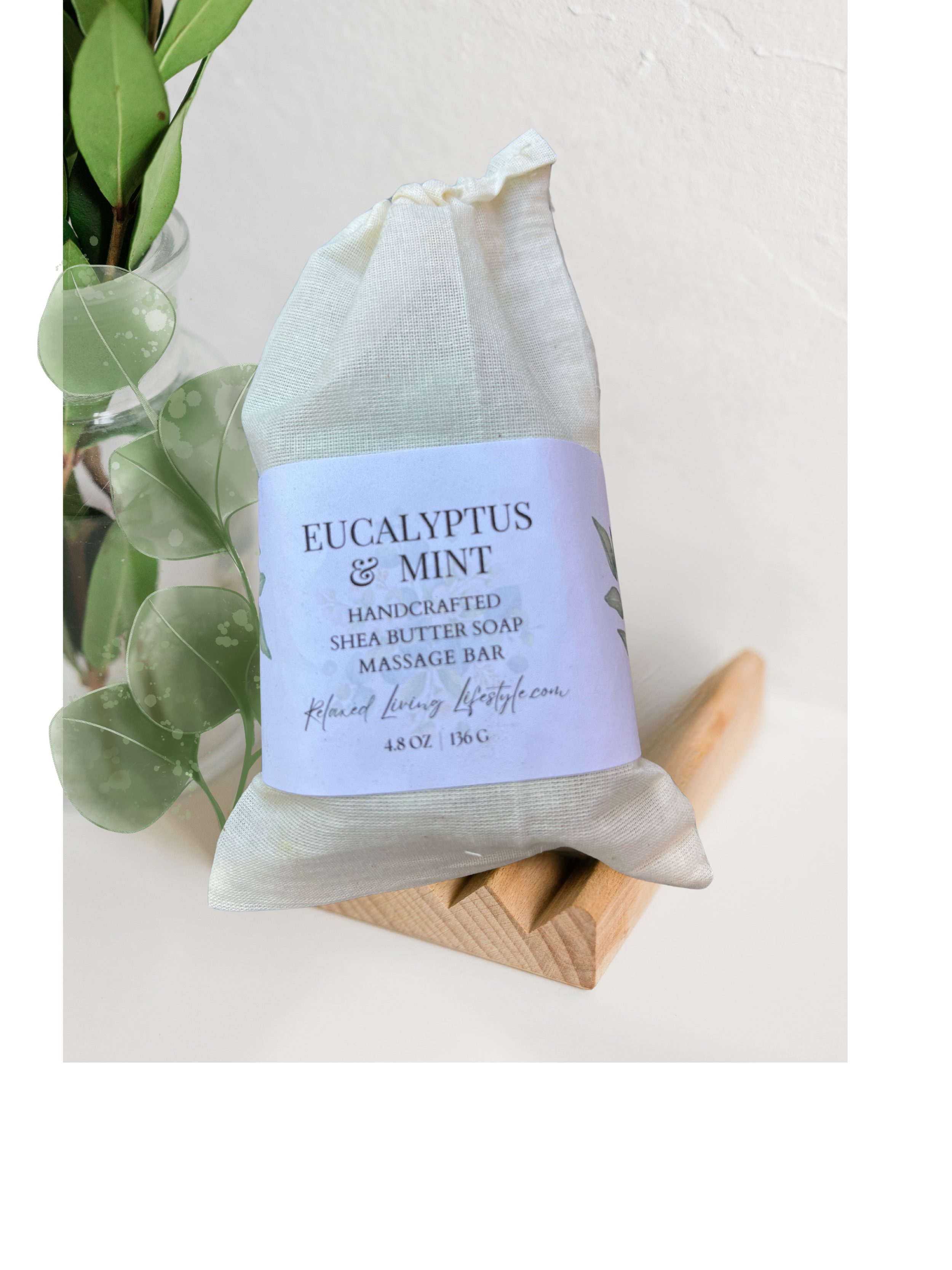Eucalyptus & Mint shea butter massage bar with textured nubs partially extended from reusable cotton bag-handcrafted spa soap by Relaxed Living Lifestyle