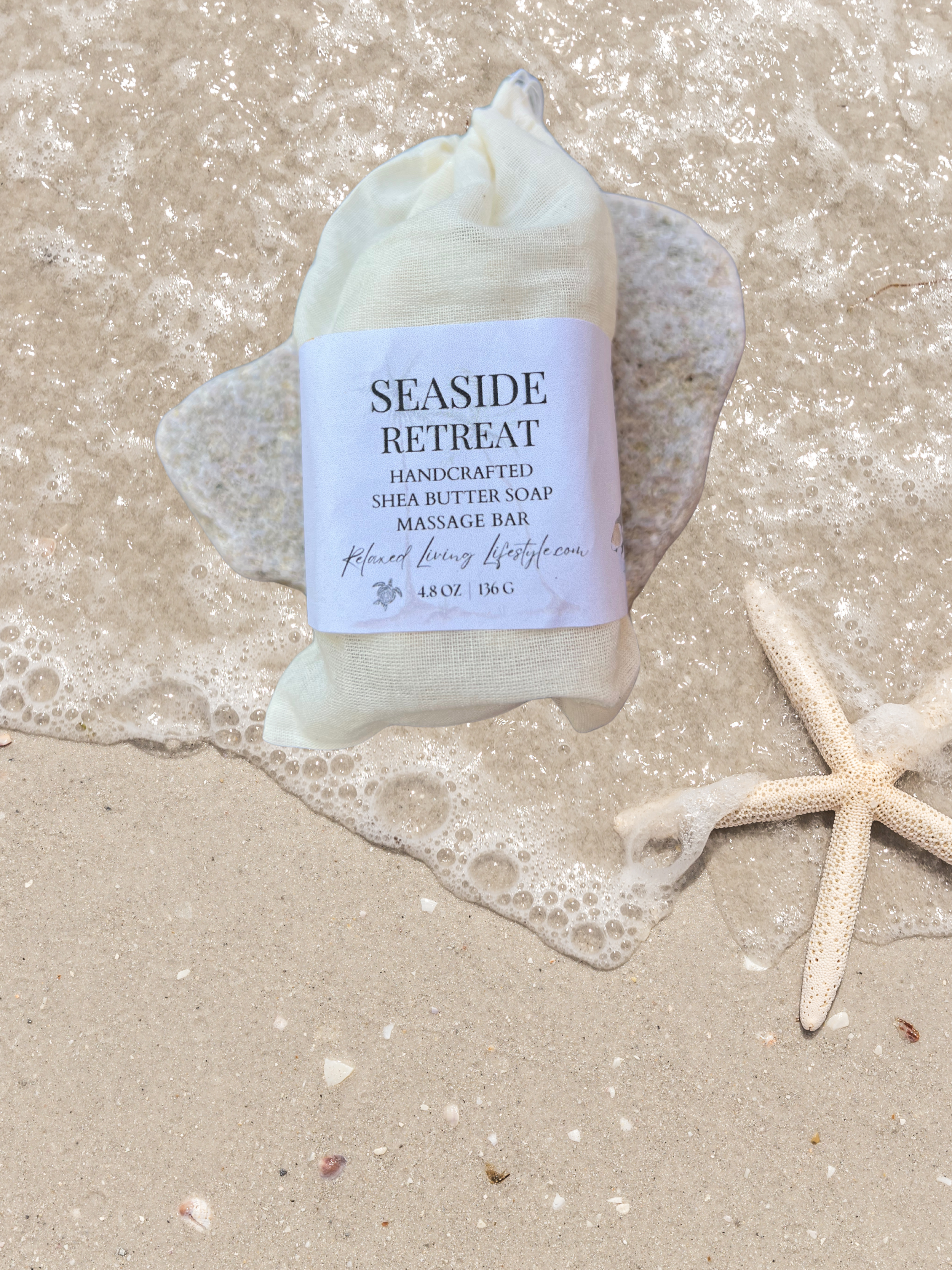Seaside Retreat shea butter massage bar in reusable cotton bag, styled with coastal neutral background-artisan beach inspired soap by Relaxed Living Lifestyle