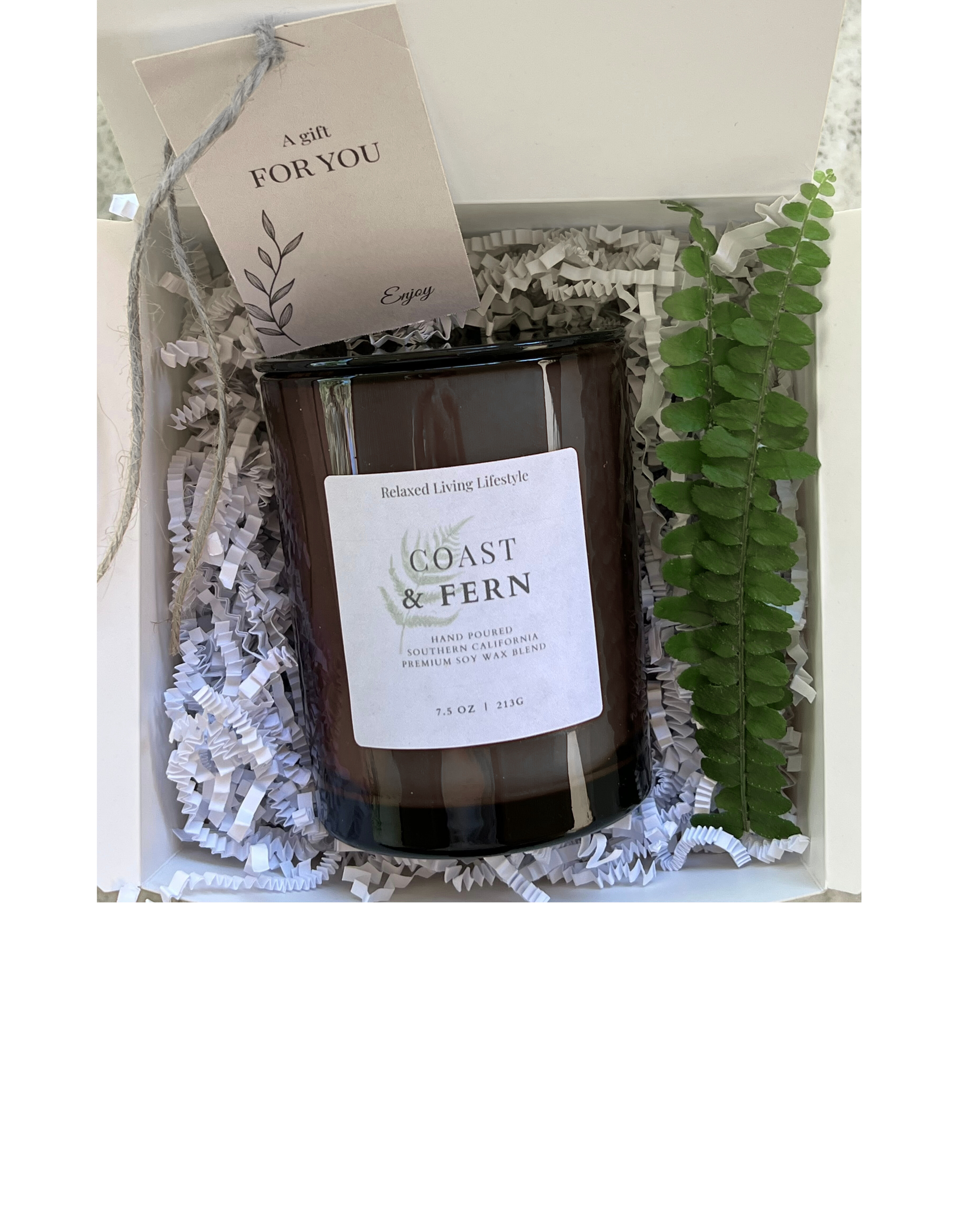 Coast & Fern candle gift box with neutral ribbon and gift tag, ready to be gifted