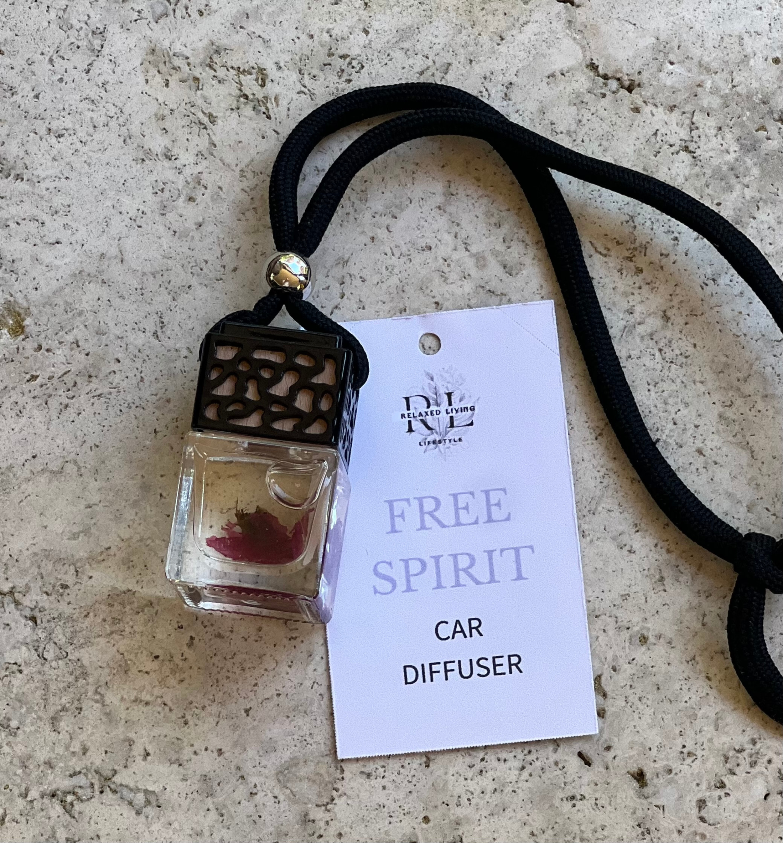 Free spirit car diffuser with fragrance tag-basil, grapefruit, rose, patchouli scent in 8ml glass bottle, relaxed living lifestyle