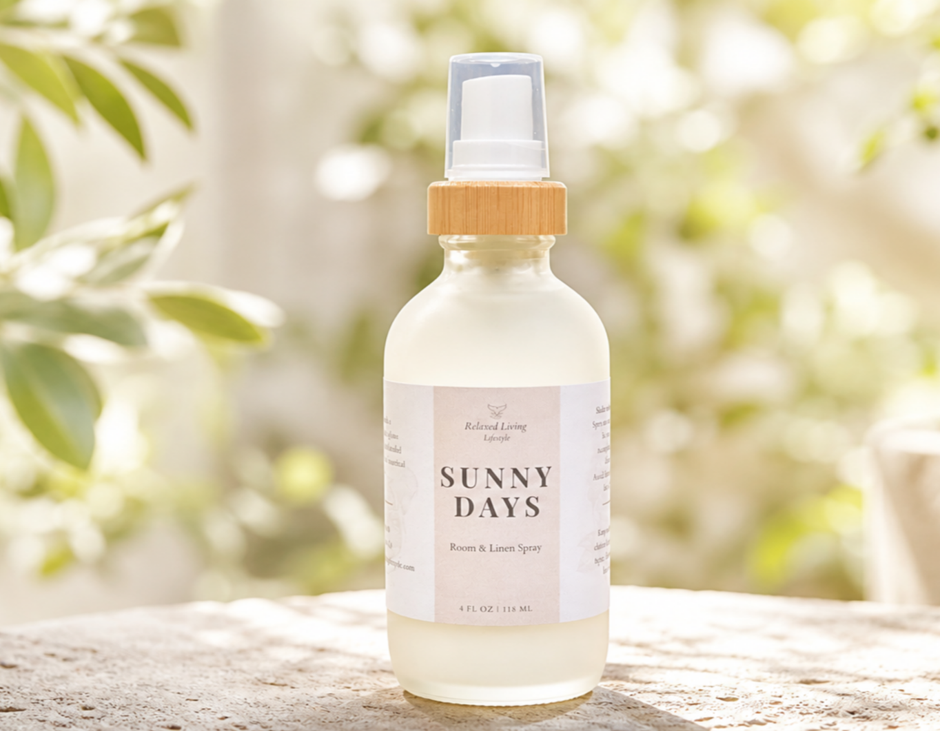 Sunny Days room & linen spray on a textured surface with blurred sunshine greenery in the background featuring fresh citrus notes of lemon peel, grapefruit, mandarin, lime, and peach.