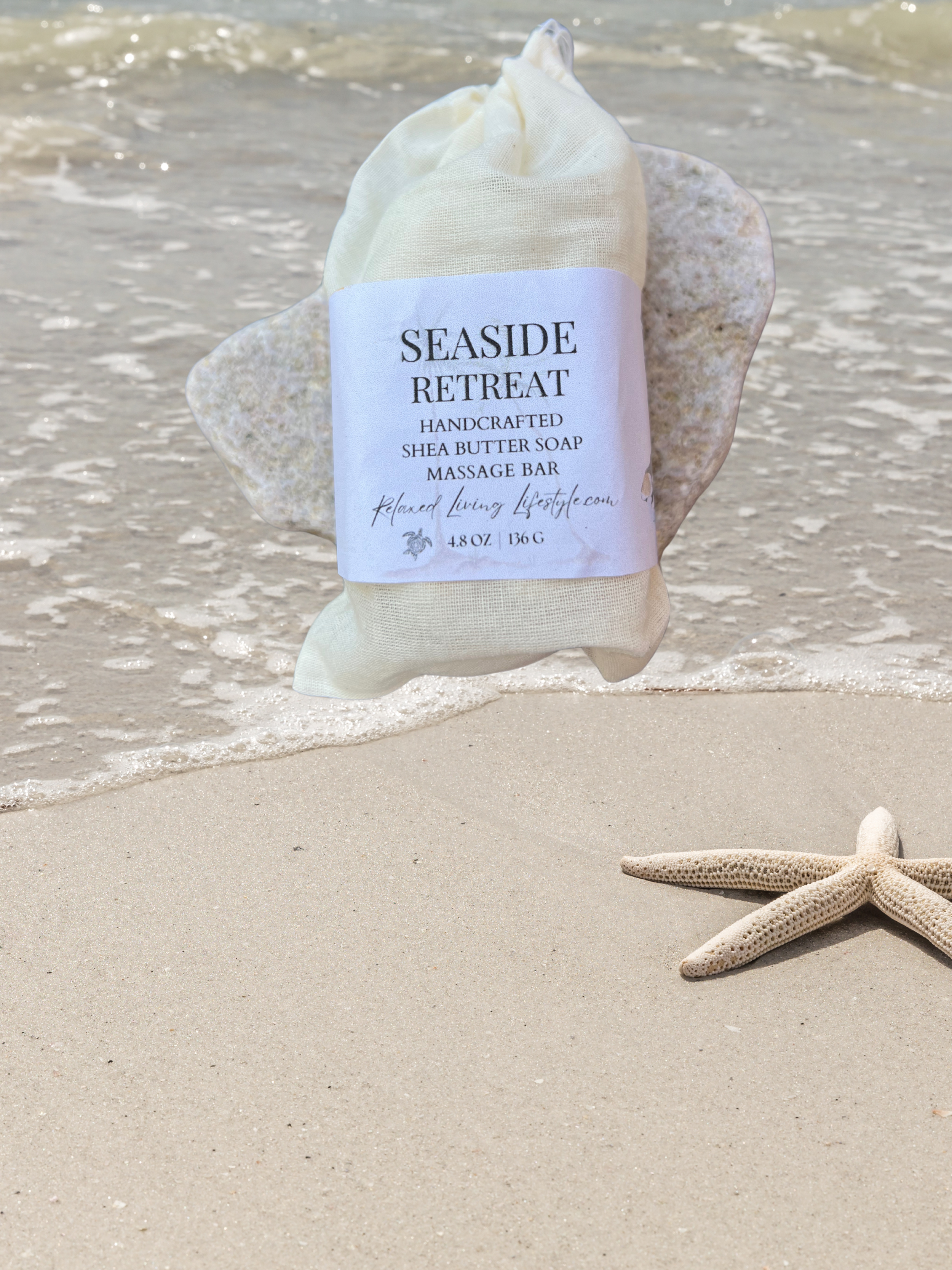 Handcrafted Seaside Retreat massage bar with ocean shore backdrop, wrapped in natural cotton bag-coastal spa soap with sea salt and bergamot notes