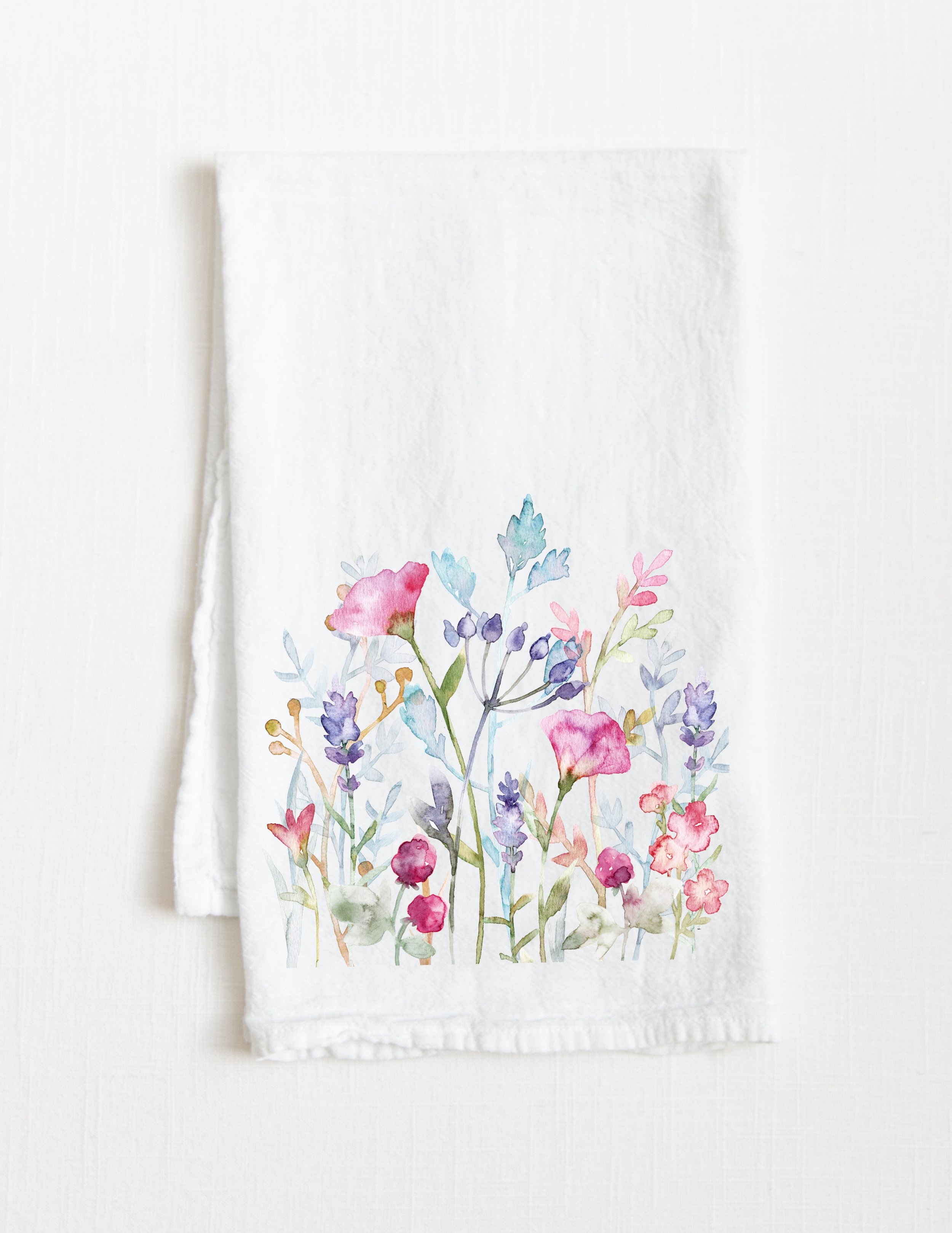 Watercolor floral cotton tea towel folded with white background
