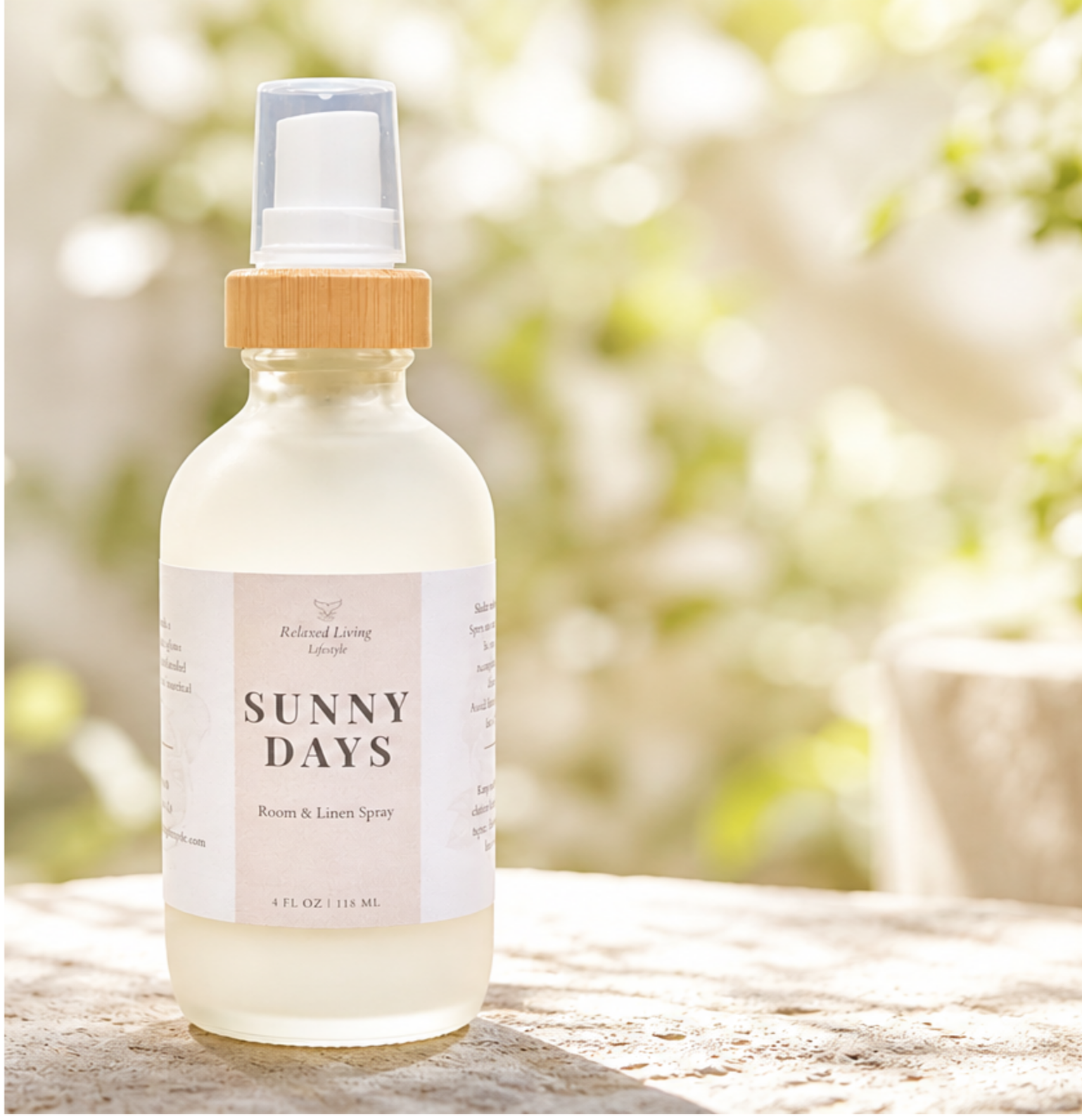 Sunny Days room & linen spray on a textured surface with blurred sunshine greenery in the background featuring fresh citrus notes of lemon peel, grapefruit, mandarin, lime, and peach.