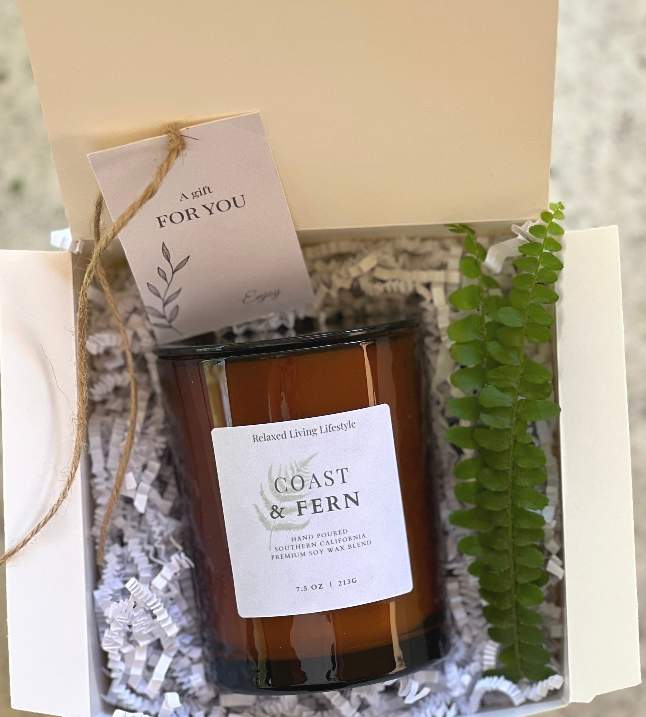 Curated candle gift box featuring Coast & Fern scented candle, ribbon-wrapped and personalized for gifting