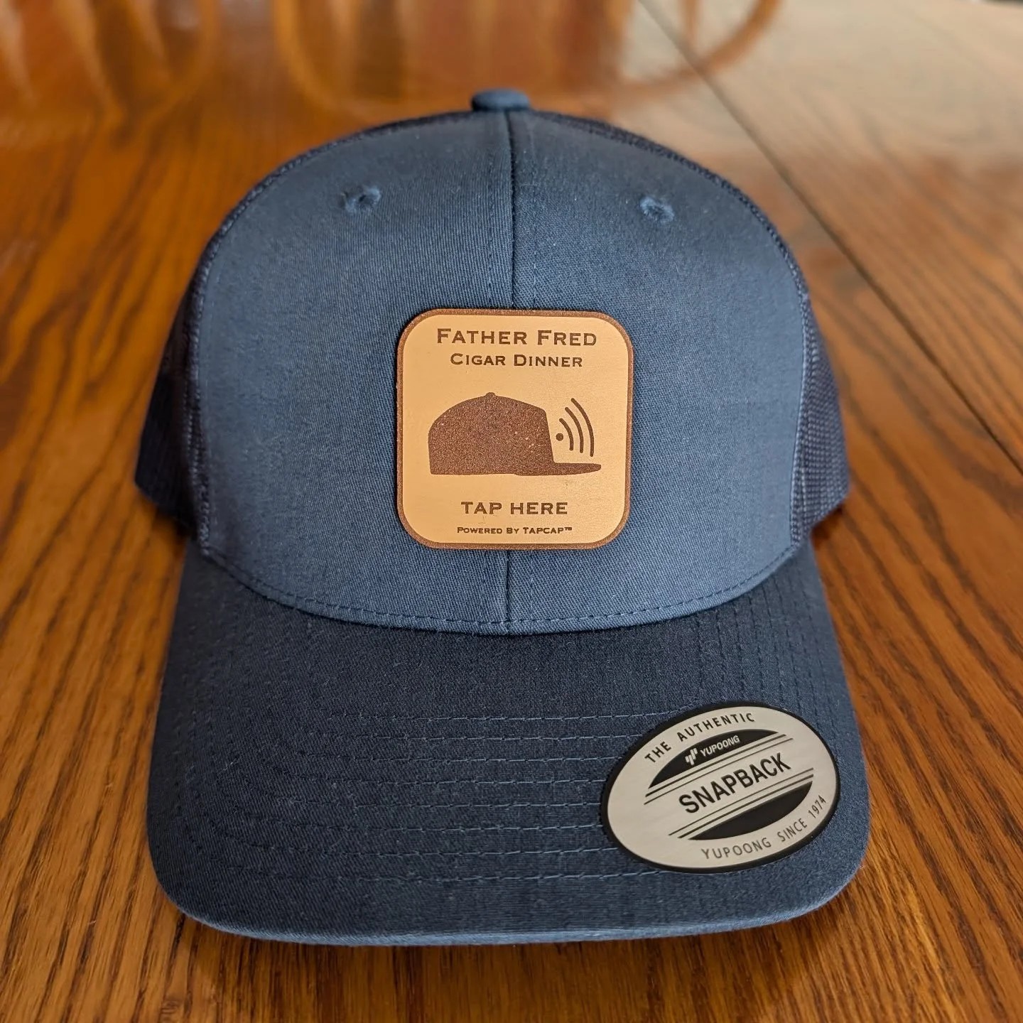 Dropped this bad boy off at Nolan&rsquo;s Cigar today 🔥

It&rsquo;ll be used as a demo hat for the @the_father_fred_foundation Cigar Dinner next month.

Attendees will have the chance to bid on:
25 custom leather patch hats powered by TapCap&trade; 