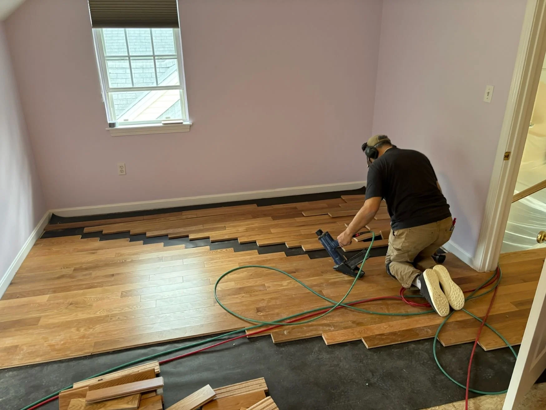 LAYING-PLANKS-FOR-HARDWOOD-FLOORING.JPG