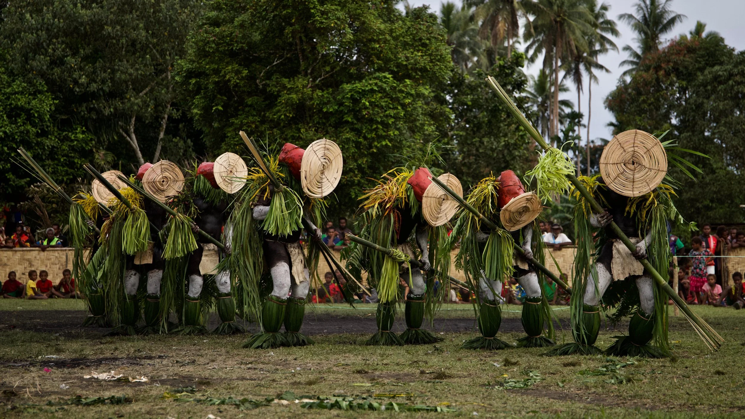 Portraits and candid moments of Papua New Guinea’s diverse cultures, featuring traditional dress, masks, and ceremonial performances.