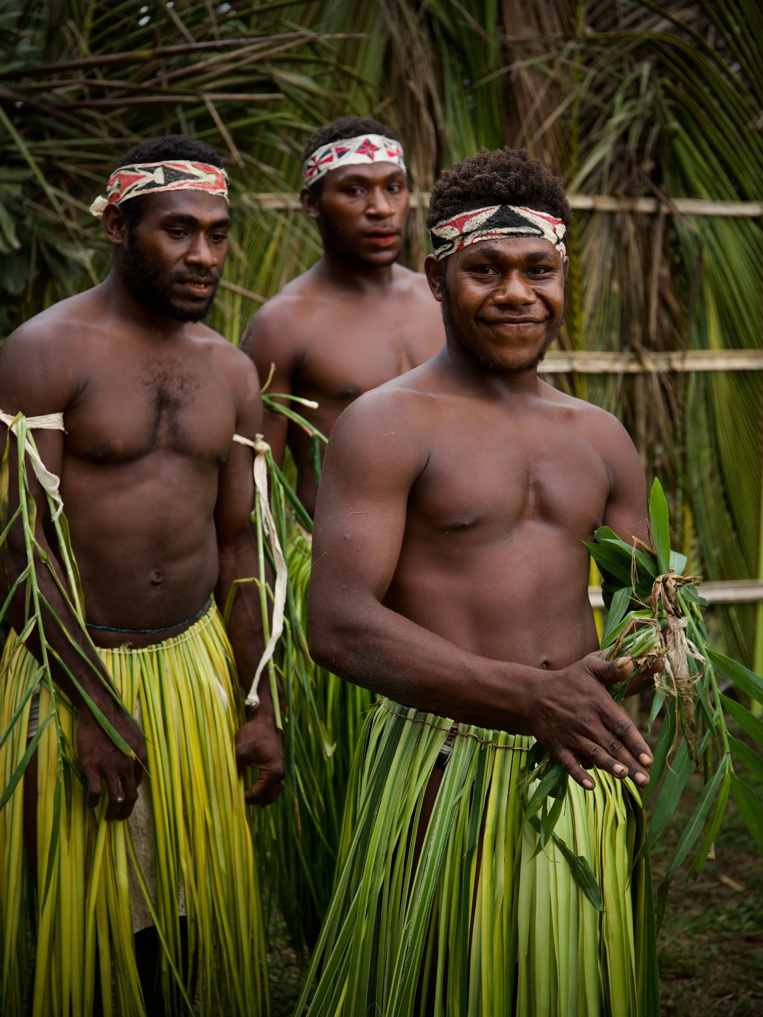 Portraits and candid moments of Papua New Guinea’s diverse cultures, featuring traditional dress, masks, and ceremonial performances.