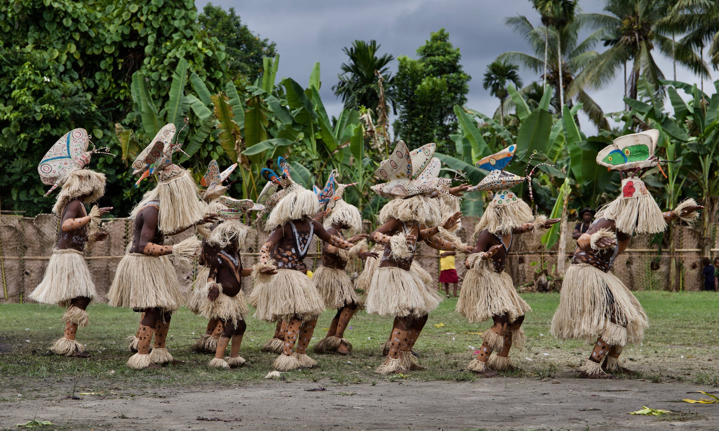 Portraits and candid moments of Papua New Guinea’s diverse cultures, featuring traditional dress, masks, and ceremonial performances.