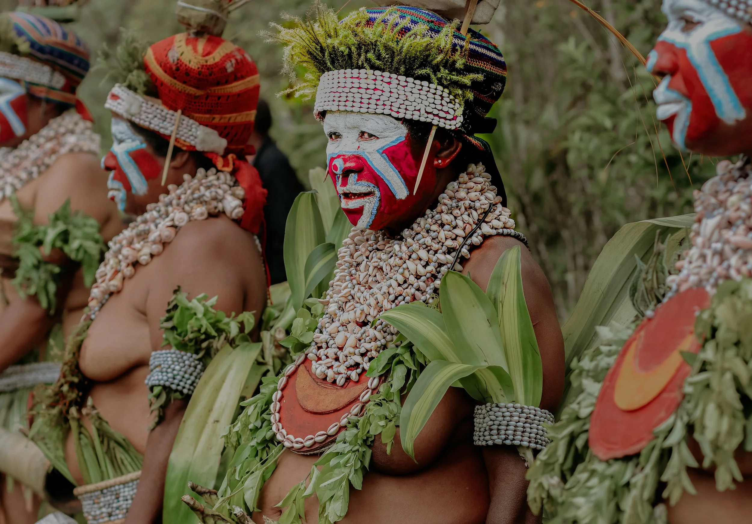 Portraits and candid moments of Papua New Guinea’s diverse cultures, featuring traditional dress, masks, and ceremonial performances.