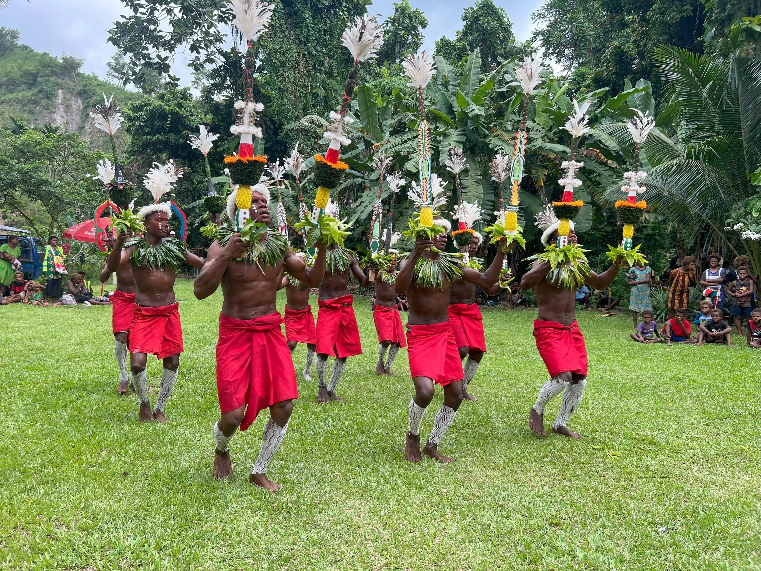 Portraits and candid moments of Papua New Guinea’s diverse cultures, featuring traditional dress, masks, and ceremonial performances.