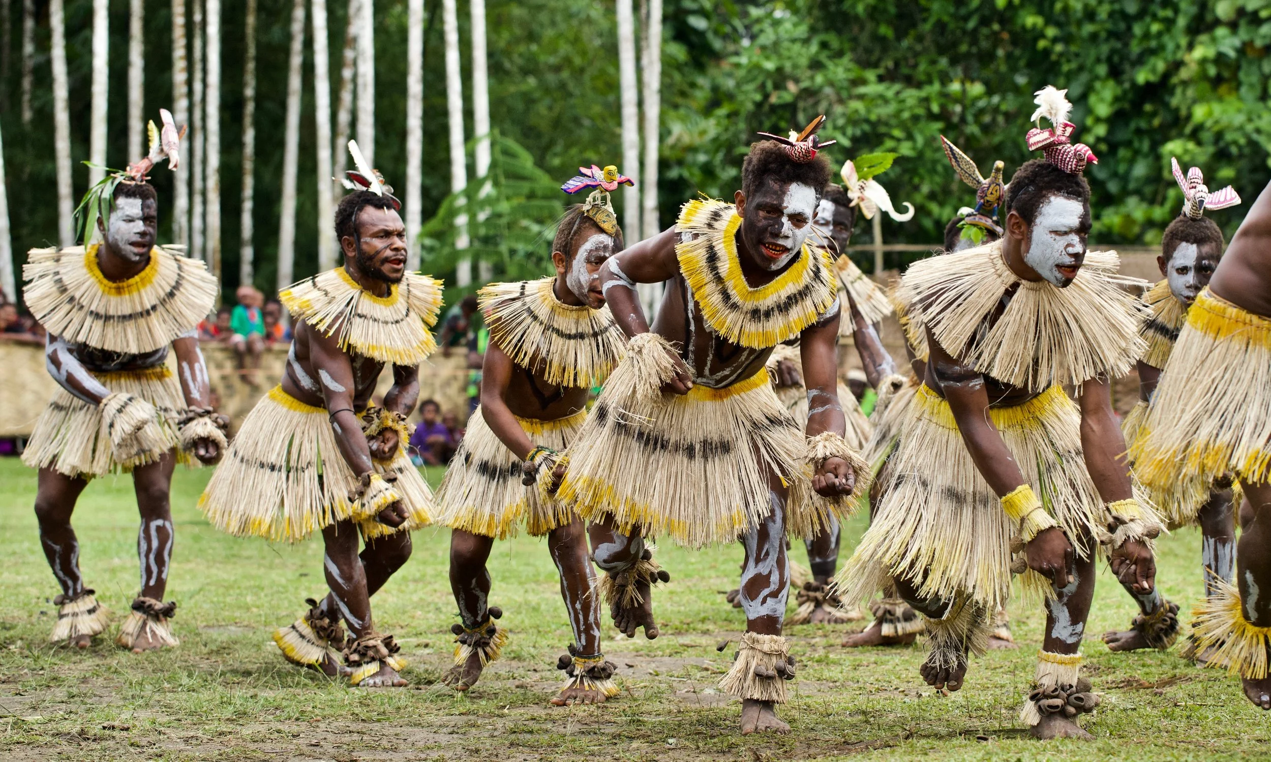 Portraits and candid moments of Papua New Guinea’s diverse cultures, featuring traditional dress, masks, and ceremonial performances.