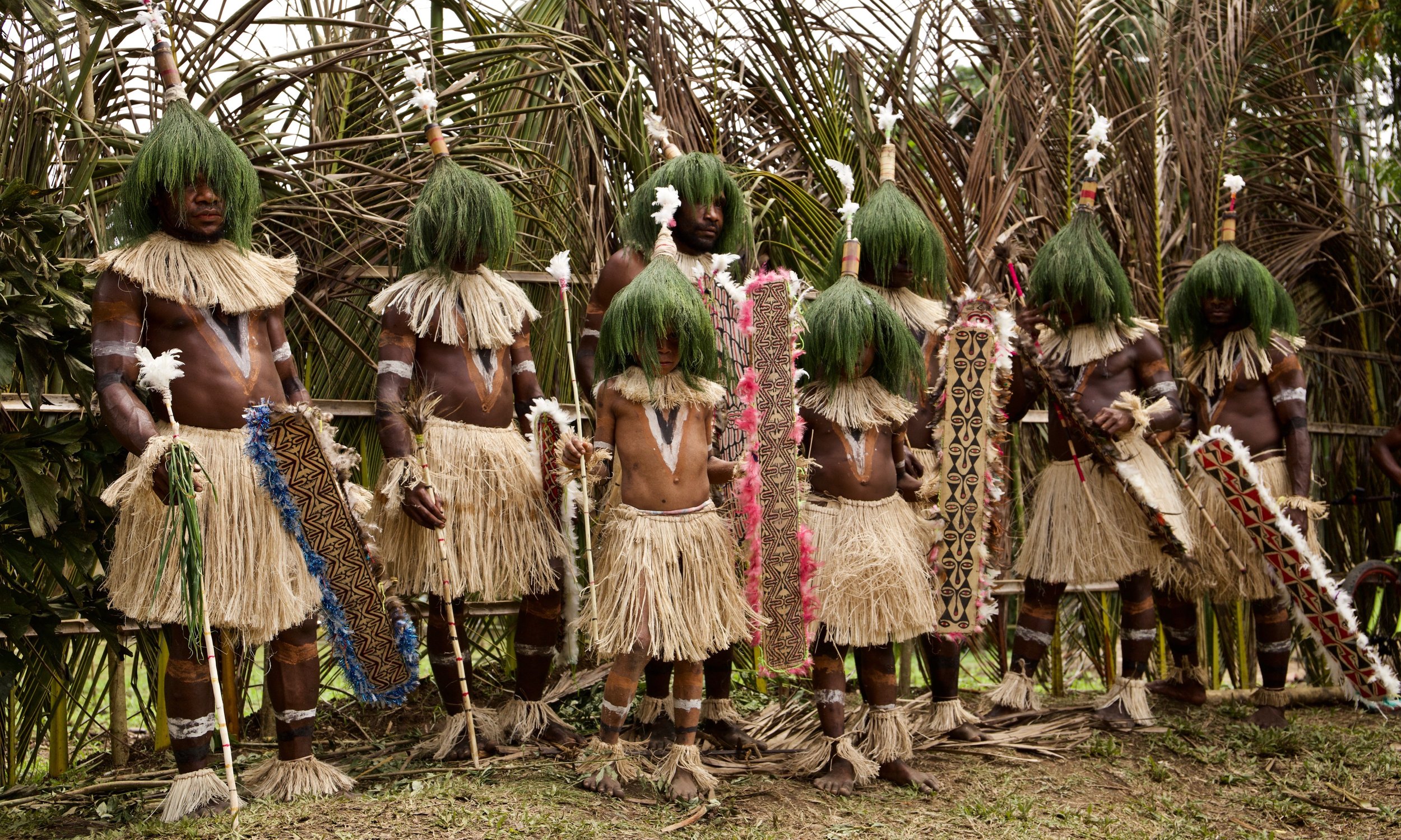 Portraits and candid moments of Papua New Guinea’s diverse cultures, featuring traditional dress, masks, and ceremonial performances.