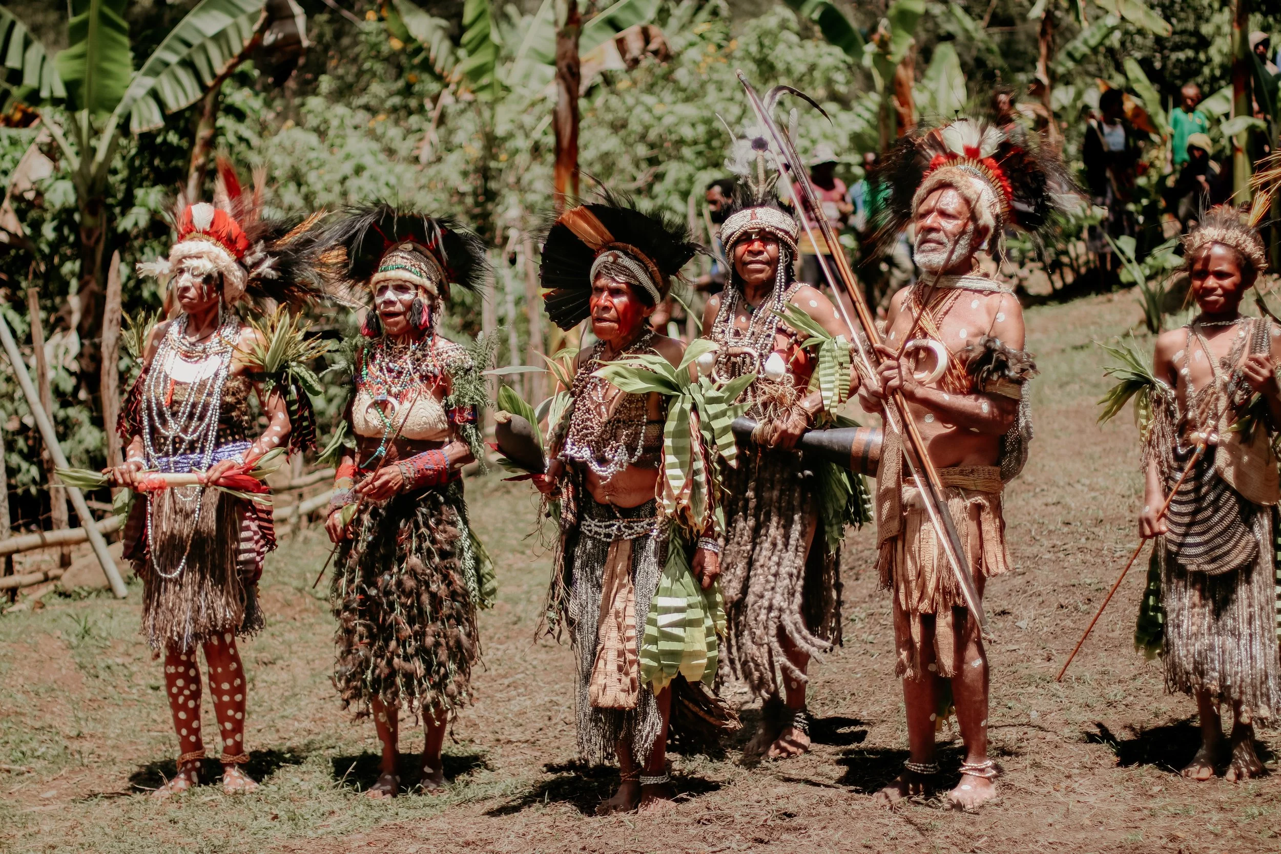Portraits and candid moments of Papua New Guinea’s diverse cultures, featuring traditional dress, masks, and ceremonial performances.