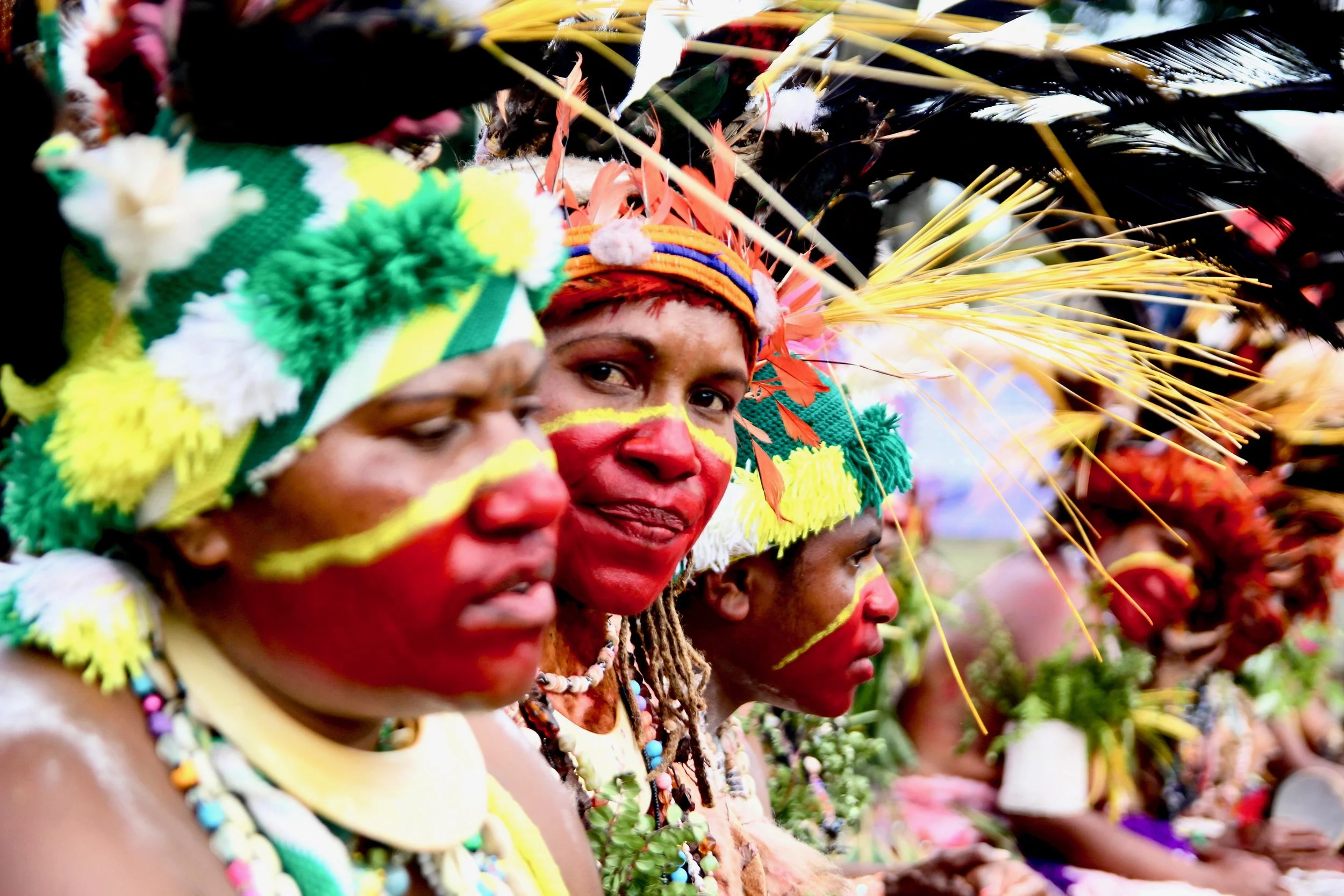 Portraits and candid moments of Papua New Guinea’s diverse cultures, featuring traditional dress, masks, and ceremonial performances.