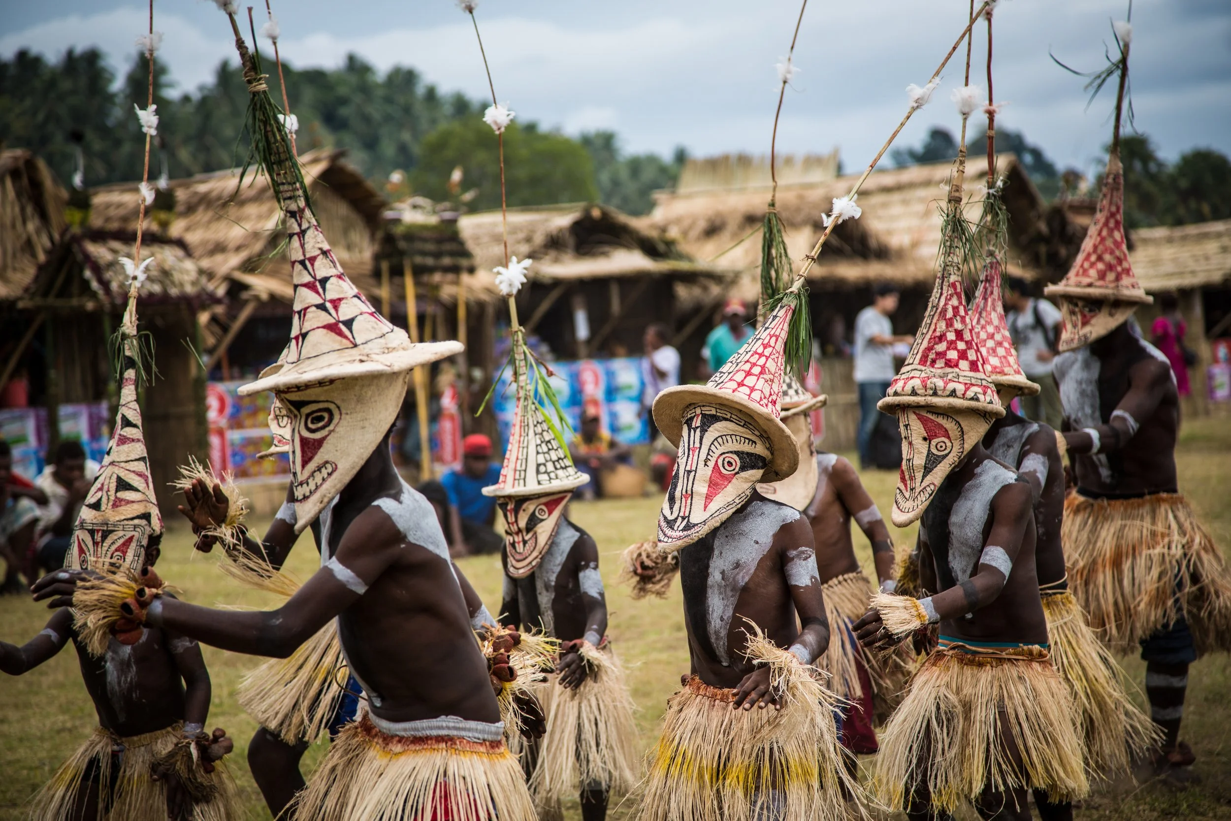 Portraits and candid moments of Papua New Guinea’s diverse cultures, featuring traditional dress, masks, and ceremonial performances.