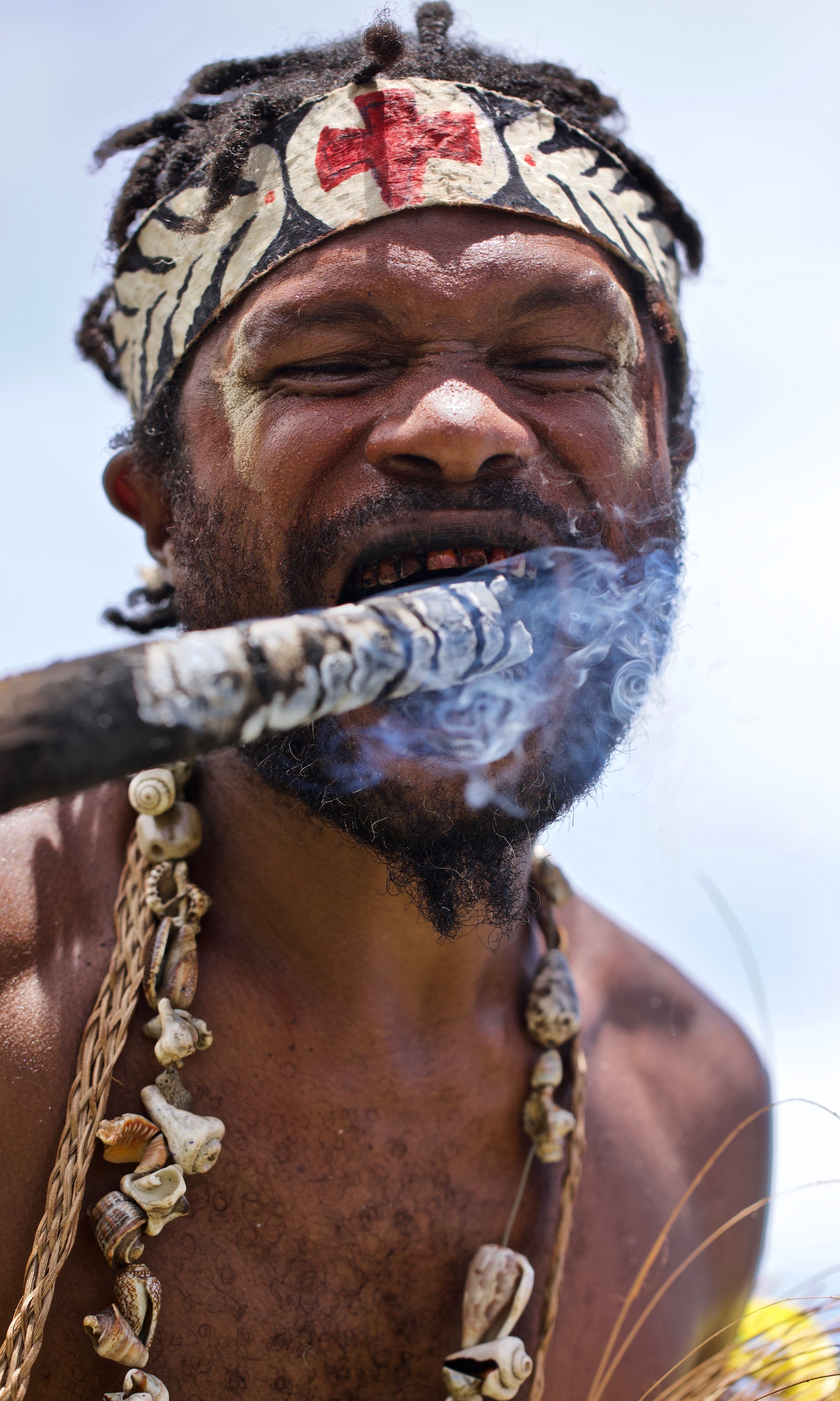Portraits and candid moments of Papua New Guinea’s diverse cultures, featuring traditional dress, masks, and ceremonial performances.