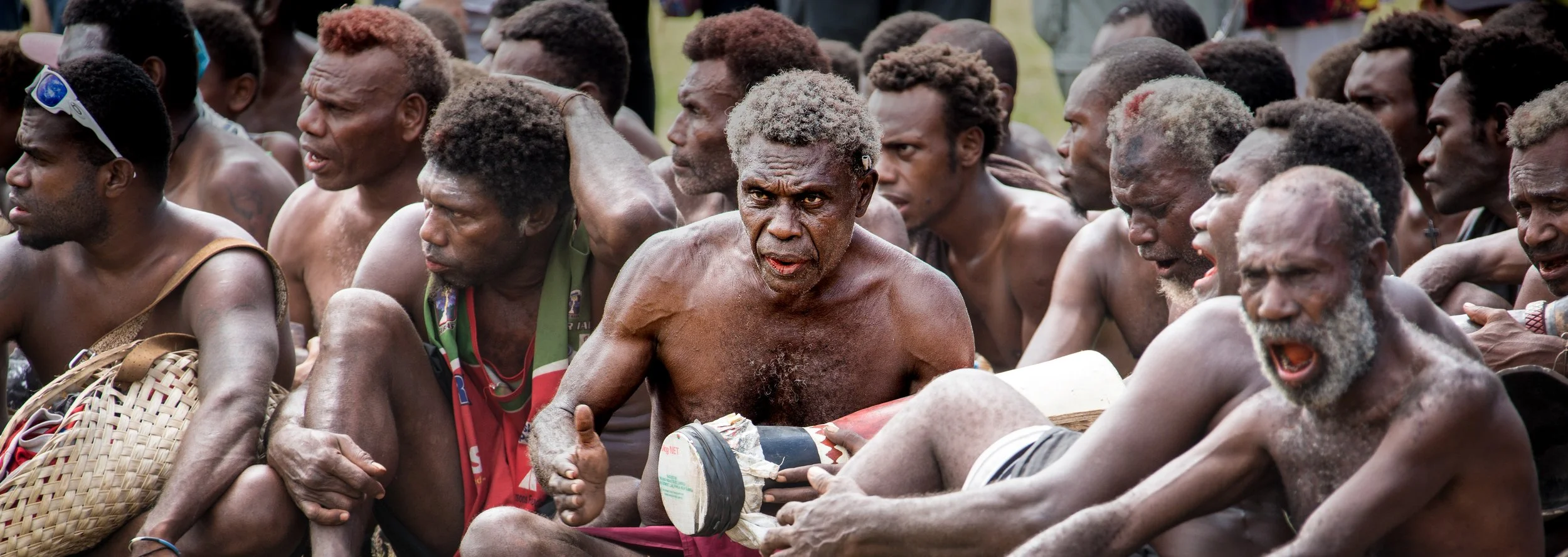 Portraits and candid moments of Papua New Guinea’s diverse cultures, featuring traditional dress, masks, and ceremonial performances.